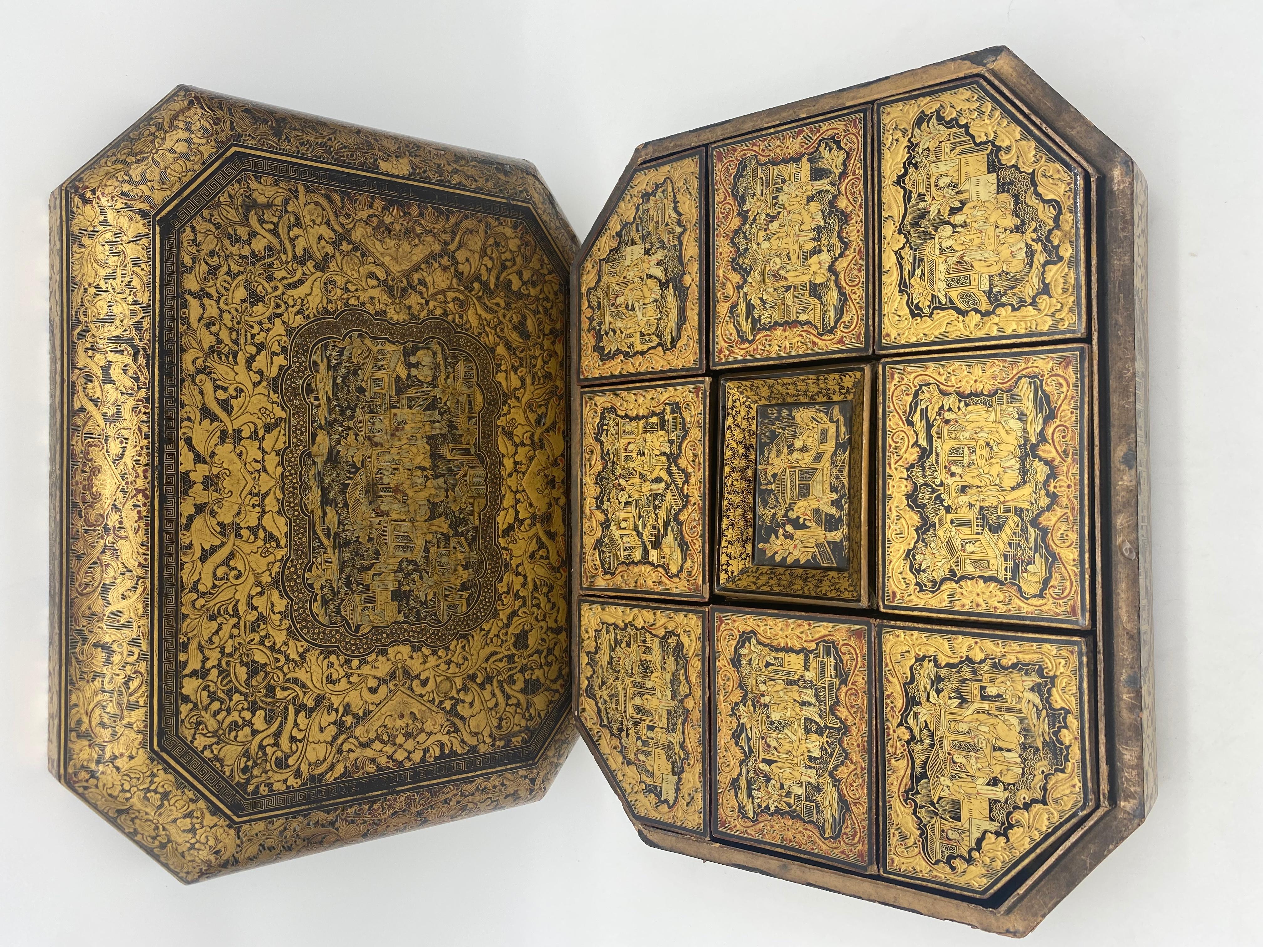 Antique 19th century export Chinese lacquer gaming box with hand painted scenes gilt export black lacquer, there are 8 gaming boxes and 6 trays, highly detailed Chinese gilt chinoiserie lacquer compartment box, the lid lifts off and the box has nine