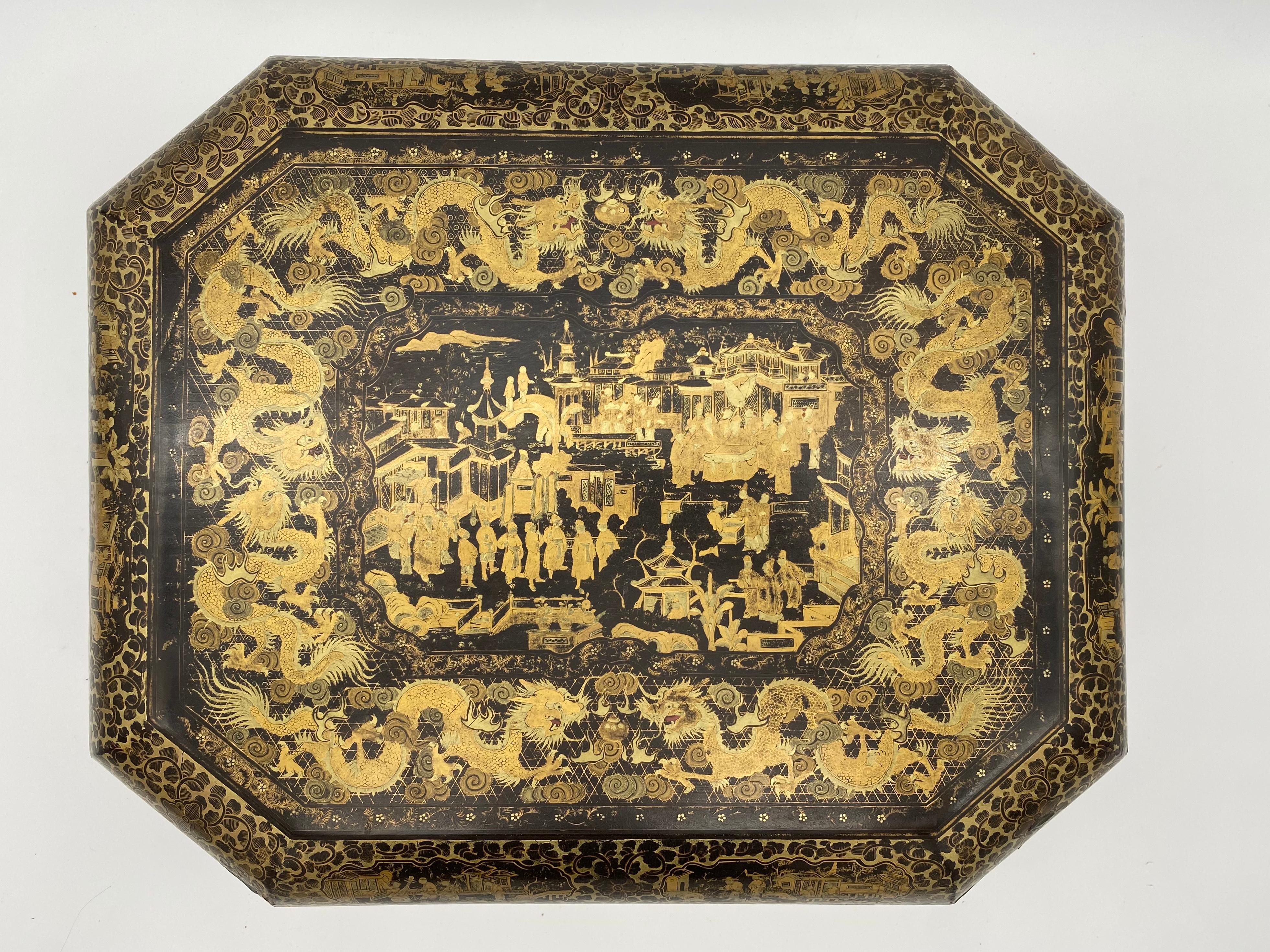 Antique 19th century export Chinese lacquer gaming box with hand painted scenes gilt export black lacquer with 4 pair of two dragons playing a ball, there are 7 gaming boxes and 12 trays, there are a gaming card and a receipt from 06-04-1974, 15