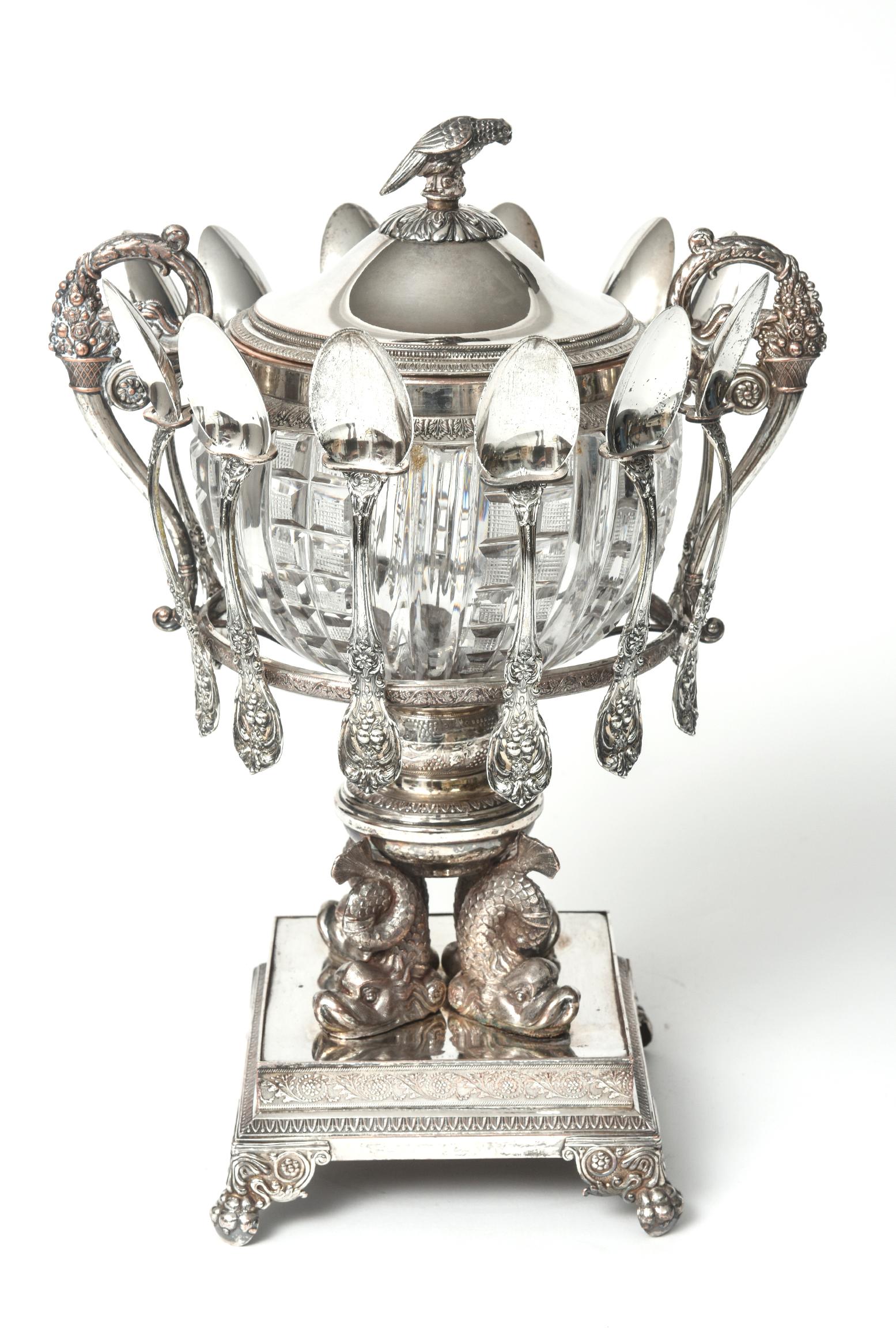 Incredible antique 19th century silver-plate covered caviar server with 12 sterling silver spoons. The lid has a parrot on fruit finial. Along the rims is a beaded and leaf design. The caviar is held in a cut crystal bowl. On the outside of the bowl