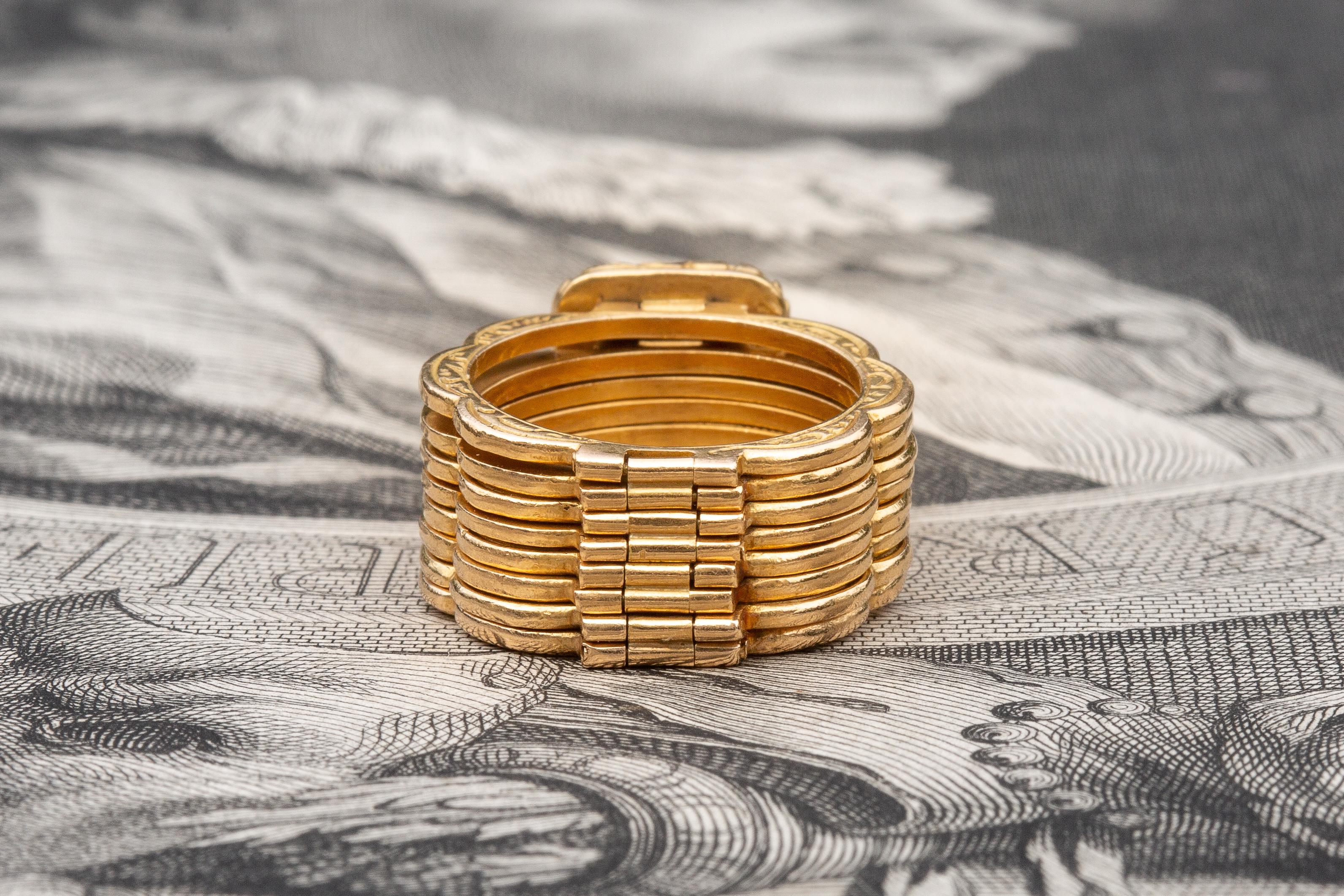 This exceptionally designed ring has a secret… It is also a bracelet!

The adaptable piece of jewellery was originally made in France and has hallmarks which date it to between 1838 and 1847. It is made up of eight articulated folding panels, each