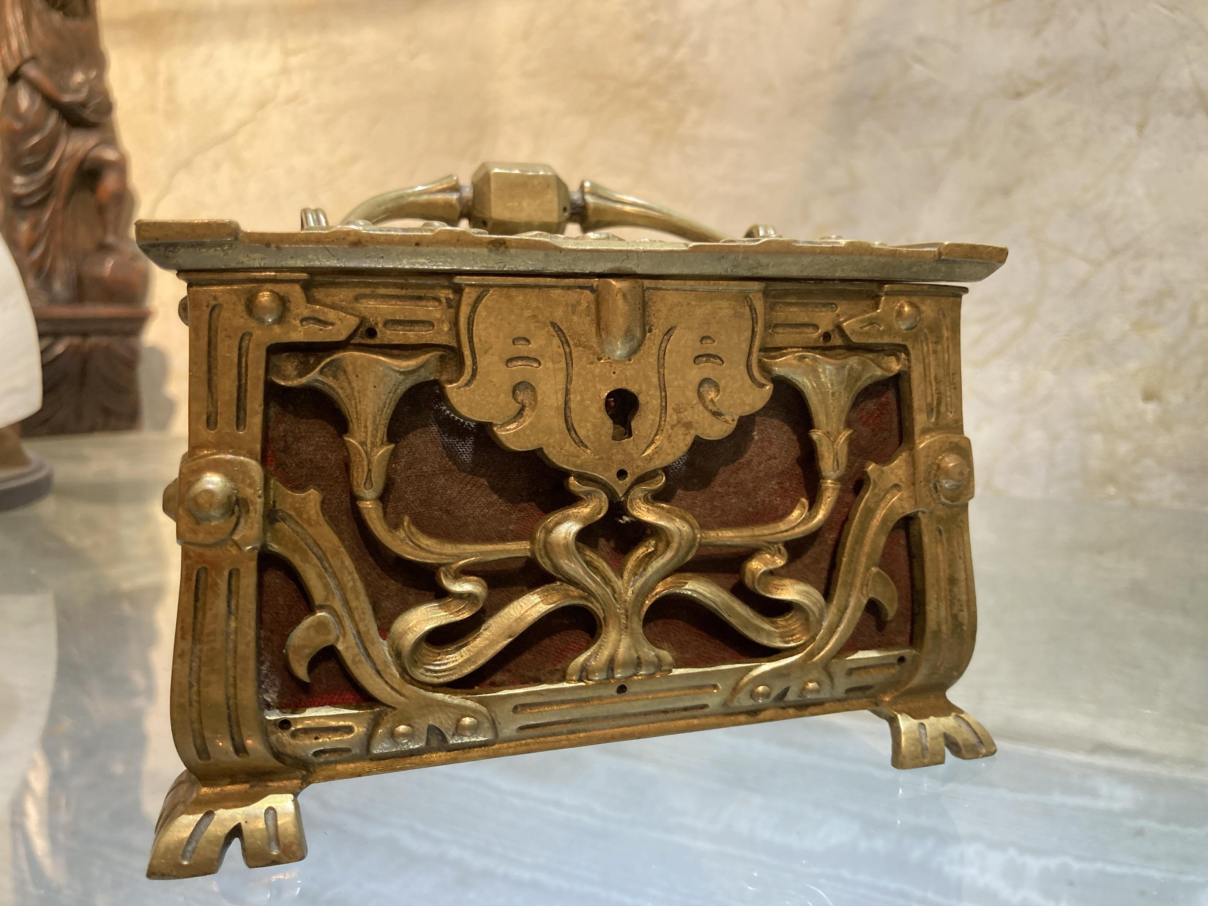This lavish French Art Nouveau period (1880-1910) jewelry box is entirely chiseled, hammered and pierced with flowers and leaf patterns. This late 19th – early 20th century rectangular shaped casket is quite substantial. The box boasts a beautiful