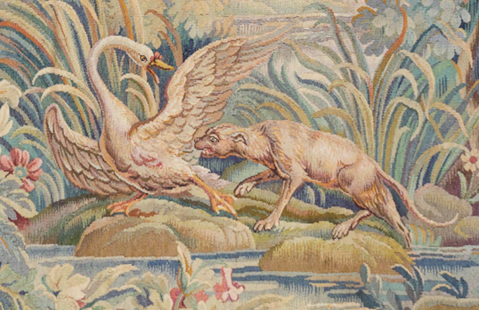 Antique 19th century French Aubusson tapestry depicting a pristine and lovely landscape on the banks of a river with a swan and wolf in the forefront. The scene is surrounded by verdant and floral grounds, a manor, and mountains in the distance.