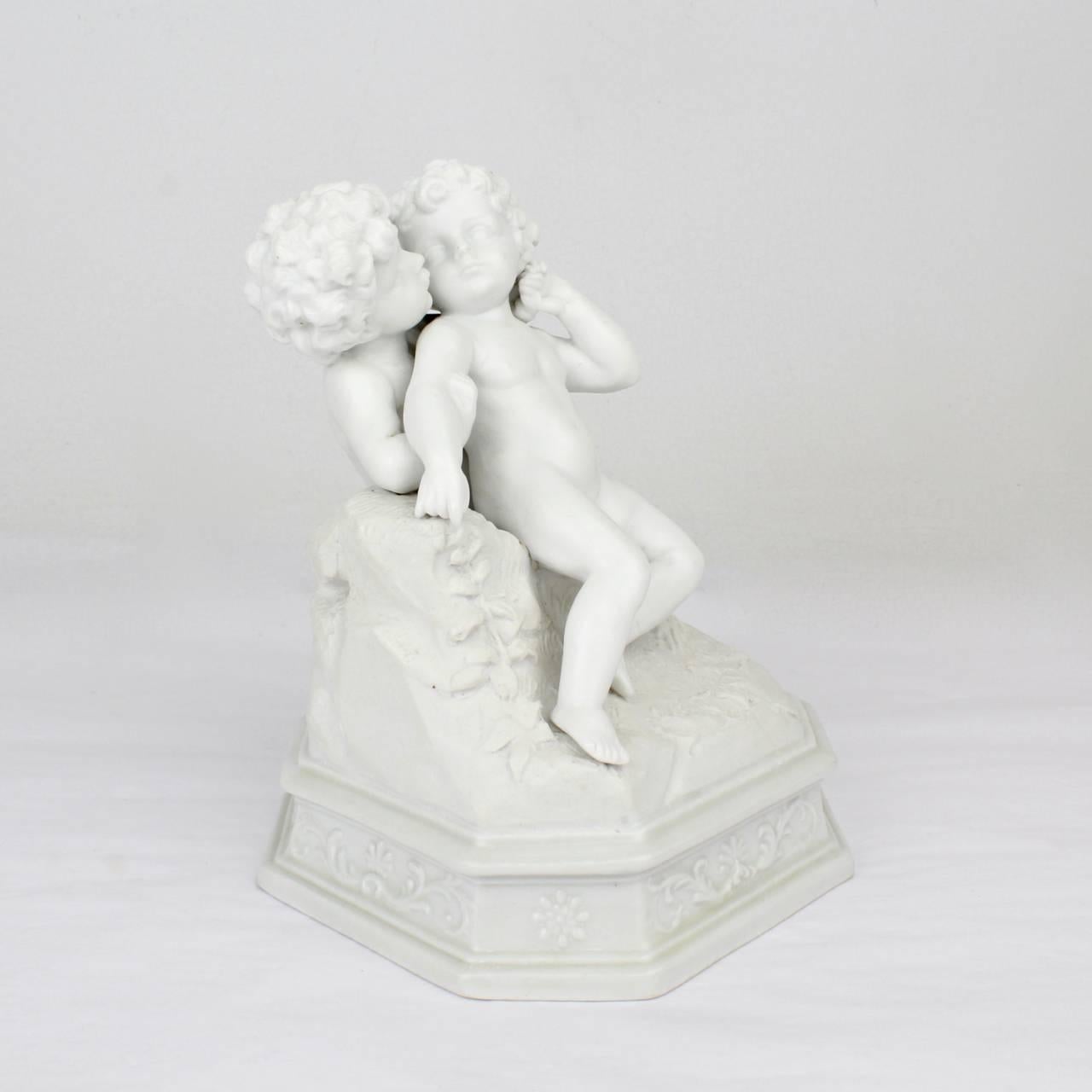 Beaux Arts Antique 19th Century French Bisque Figurine of Two Putti in an Amorous Embrace For Sale