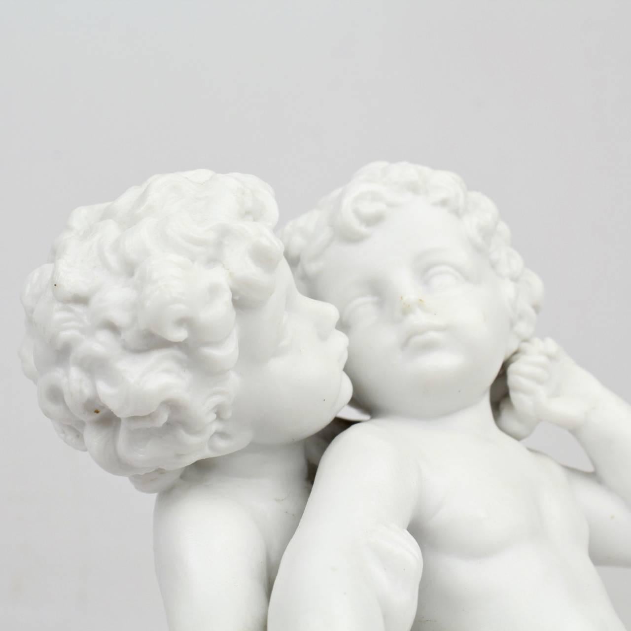 Antique 19th Century French Bisque Figurine of Two Putti in an Amorous Embrace In Good Condition For Sale In Philadelphia, PA