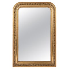 Antiquité française du XIXe siècle, dorée à la feuille d'or et au noir.  Miroir Louis Philippe