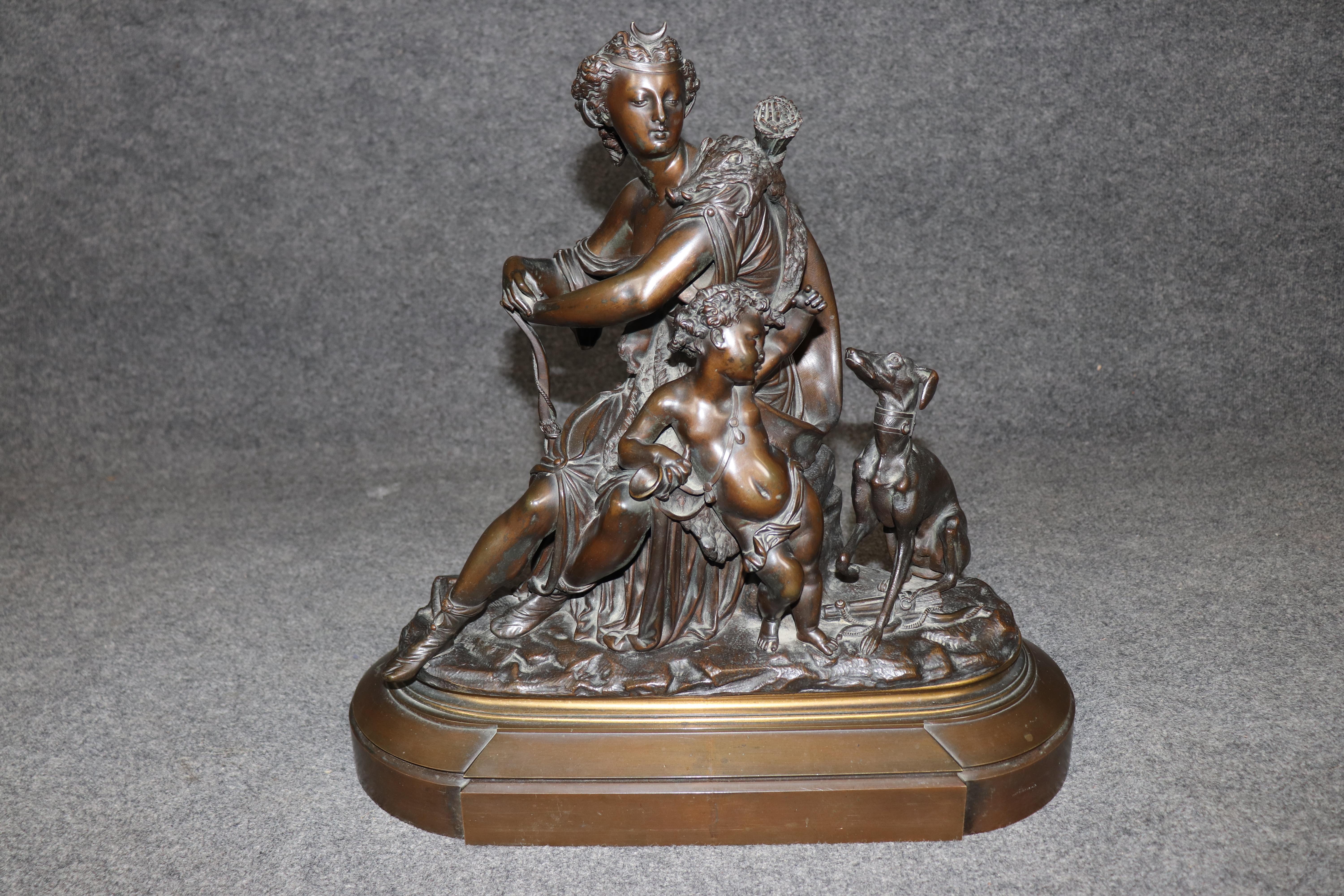 Dimensions - H: 19 1/4 in W: 20 in D: 8 in 

This exceptional late 19th-century French bronze sculpture by the renowned artist Auguste Moreau (1834–1917) presents an elegant and powerful representation of Diana the Huntress, the ancient Roman