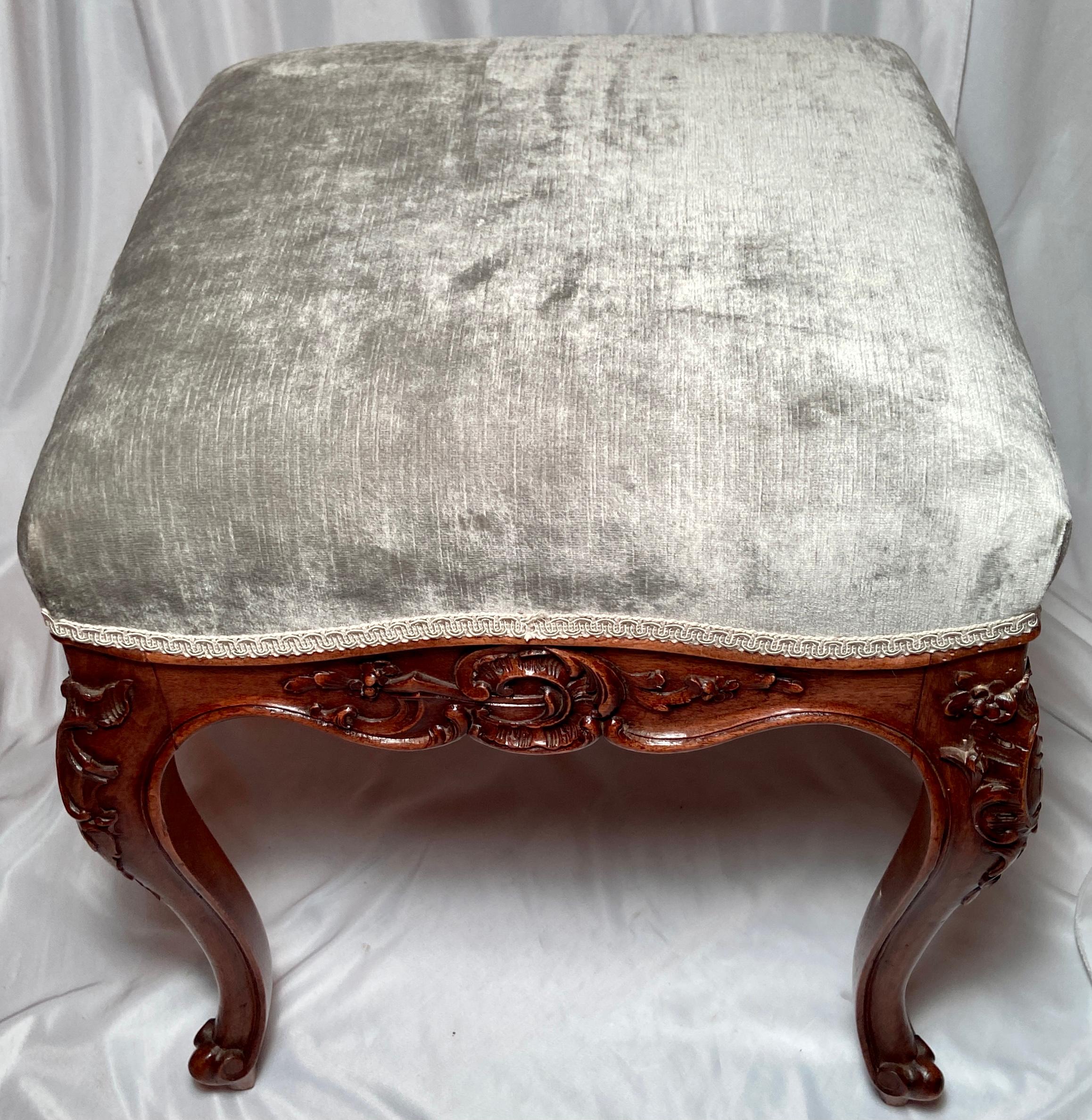 Antique 19th century French carved walnut bench with new upholstery.
There are 2 of these available, each sold individually.
