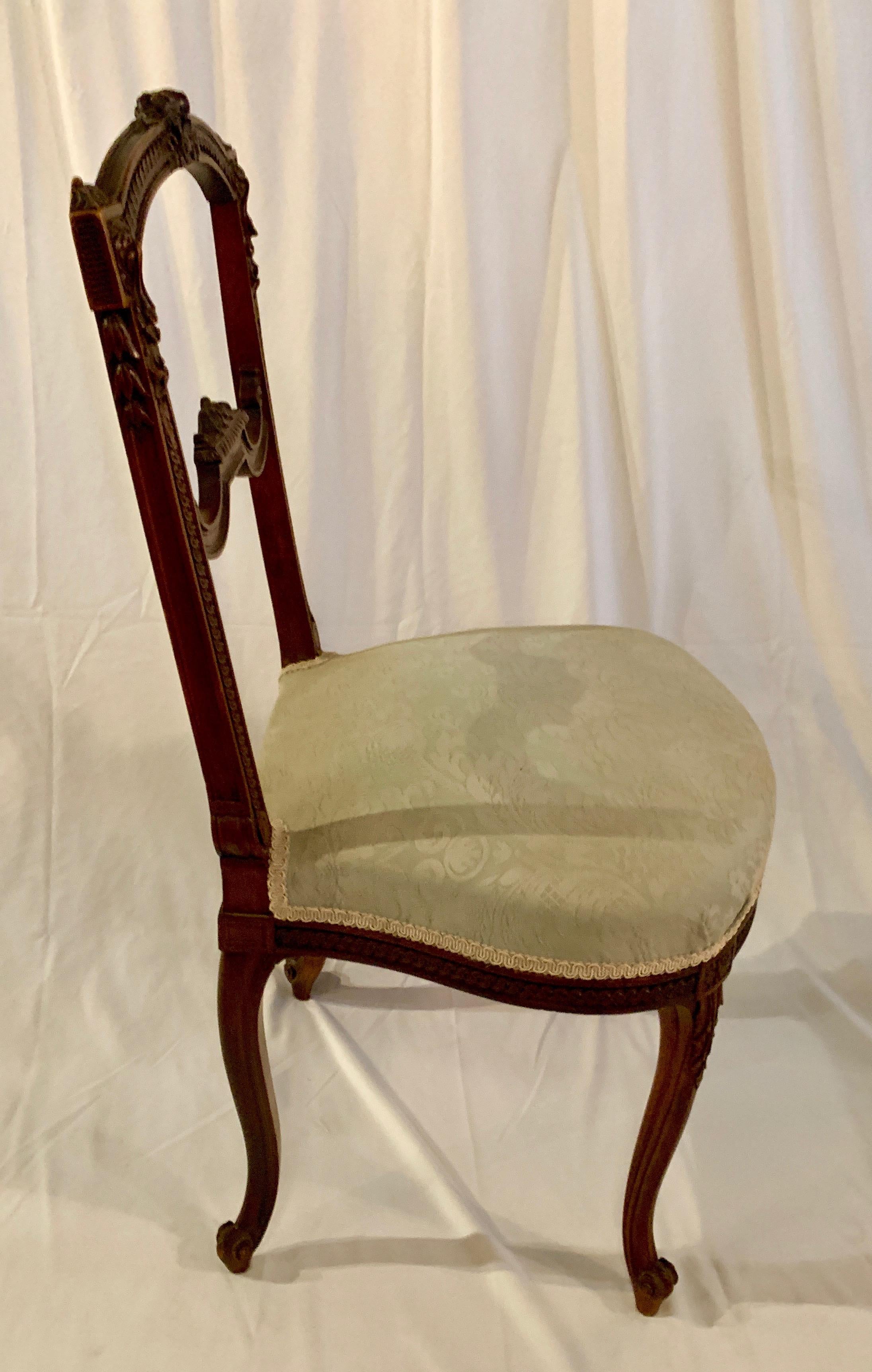 A nicely carved small French chair. The very perfect occasional chair for a salon or dressing room area.