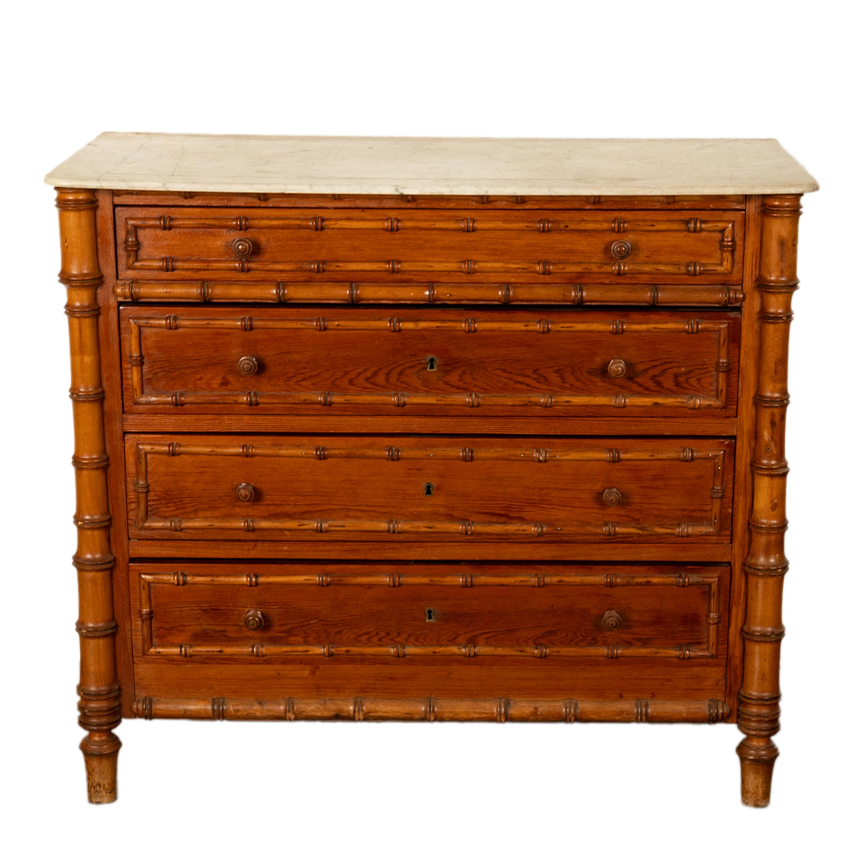 A good antique 19th century French Empire faux bamboo & white marble pine four drawer commode/chest of drawers, circa 1880.
The chest having the original veined white marble top above four drawers, each drawer having twin turned pulls, the drawers
