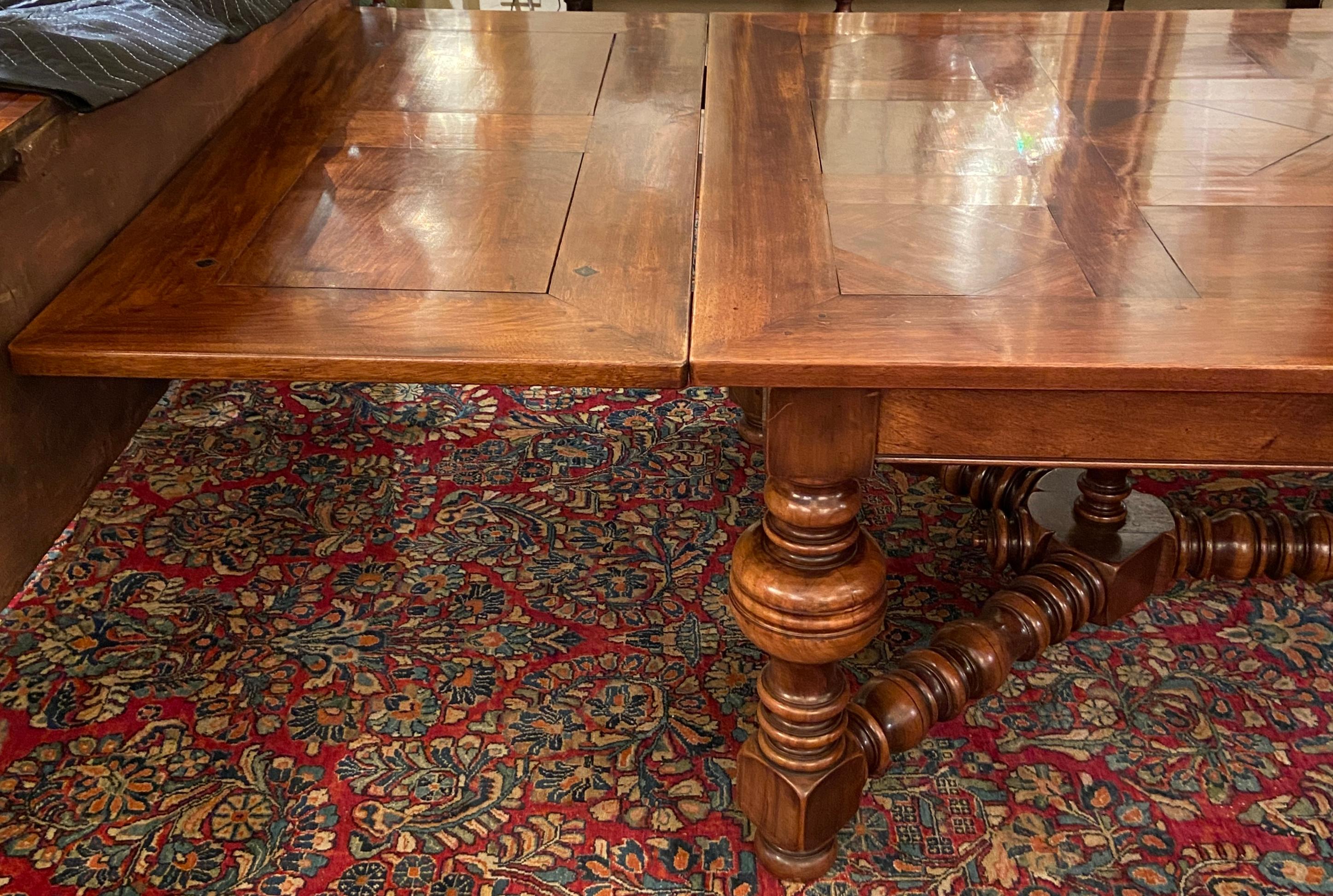 Antique 19th century French Francois Premier carved walnut drawleaf dining table.
Measures: Height: 30 inches 
Width: 83 inches (132 inches extended) 
Depth: 50 inches.