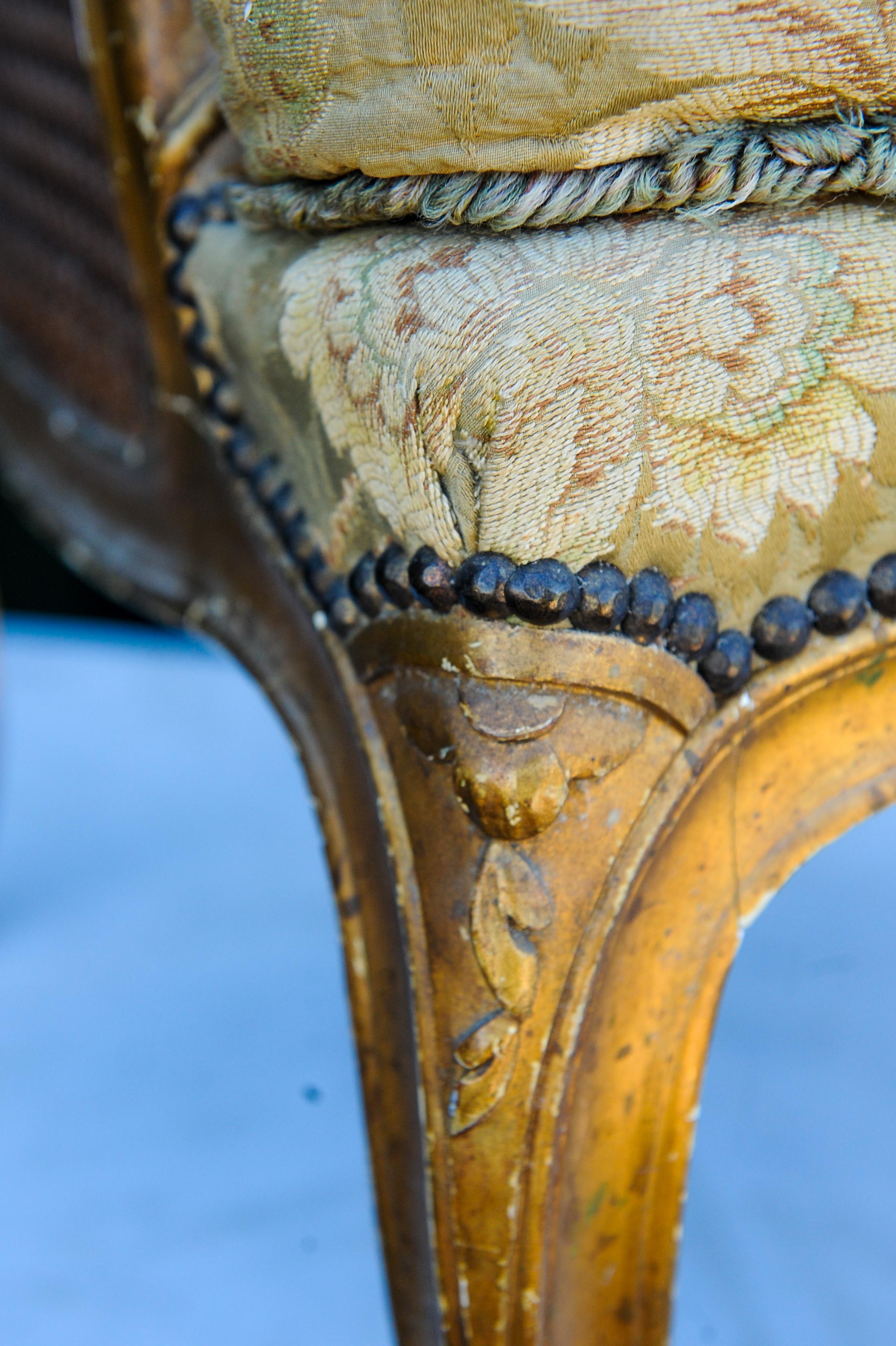 Brass Antique 19th Century French Gilded Bergere Armchair with Stud Detailing For Sale