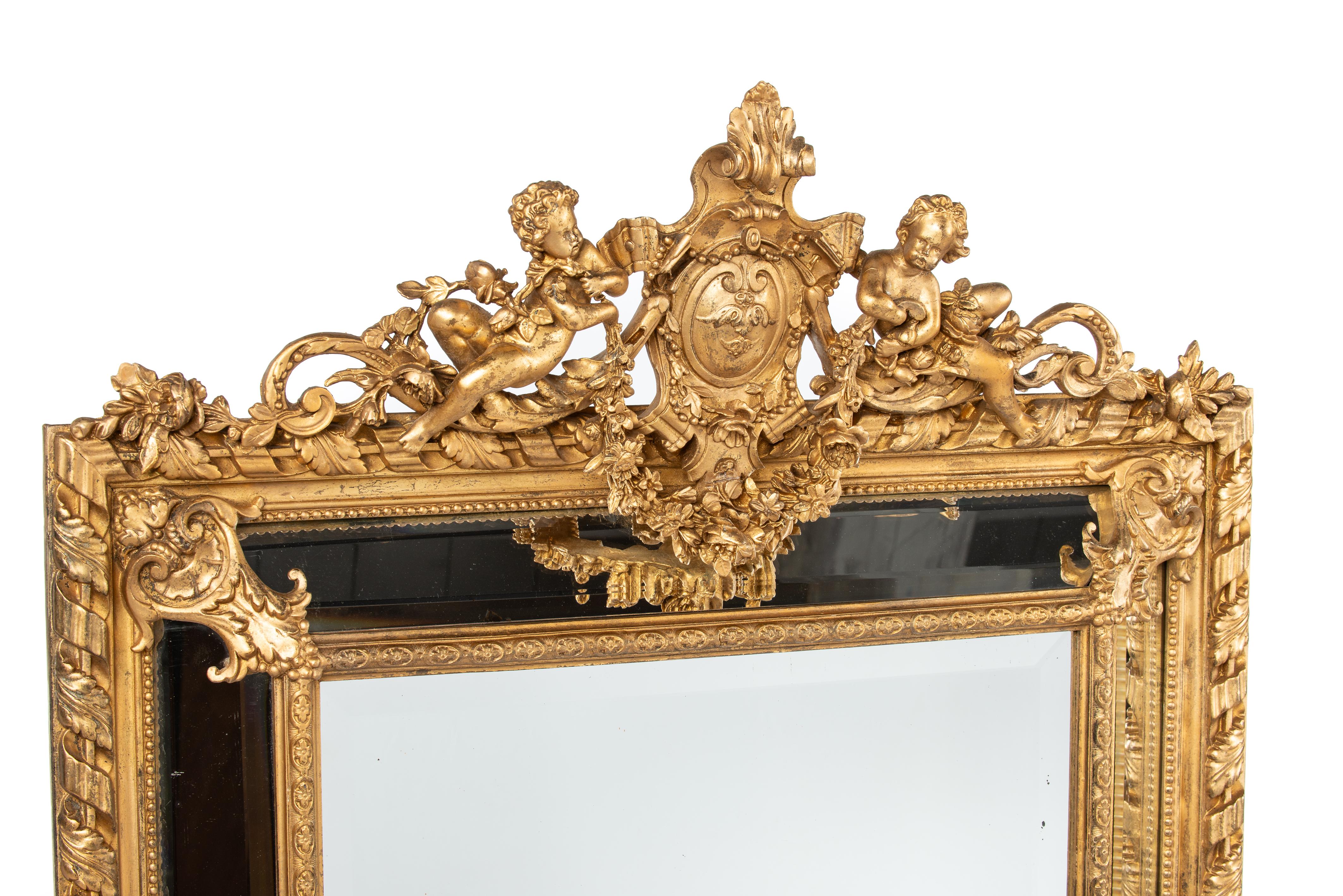 On offer here is a beautiful antique gold leaf gilt parecloses mirror that was made in France in the late 19th century, circa 1880. The shape of the mirror frame and the decorations used are typical for the Louis XVI, or Empire style. The mirror