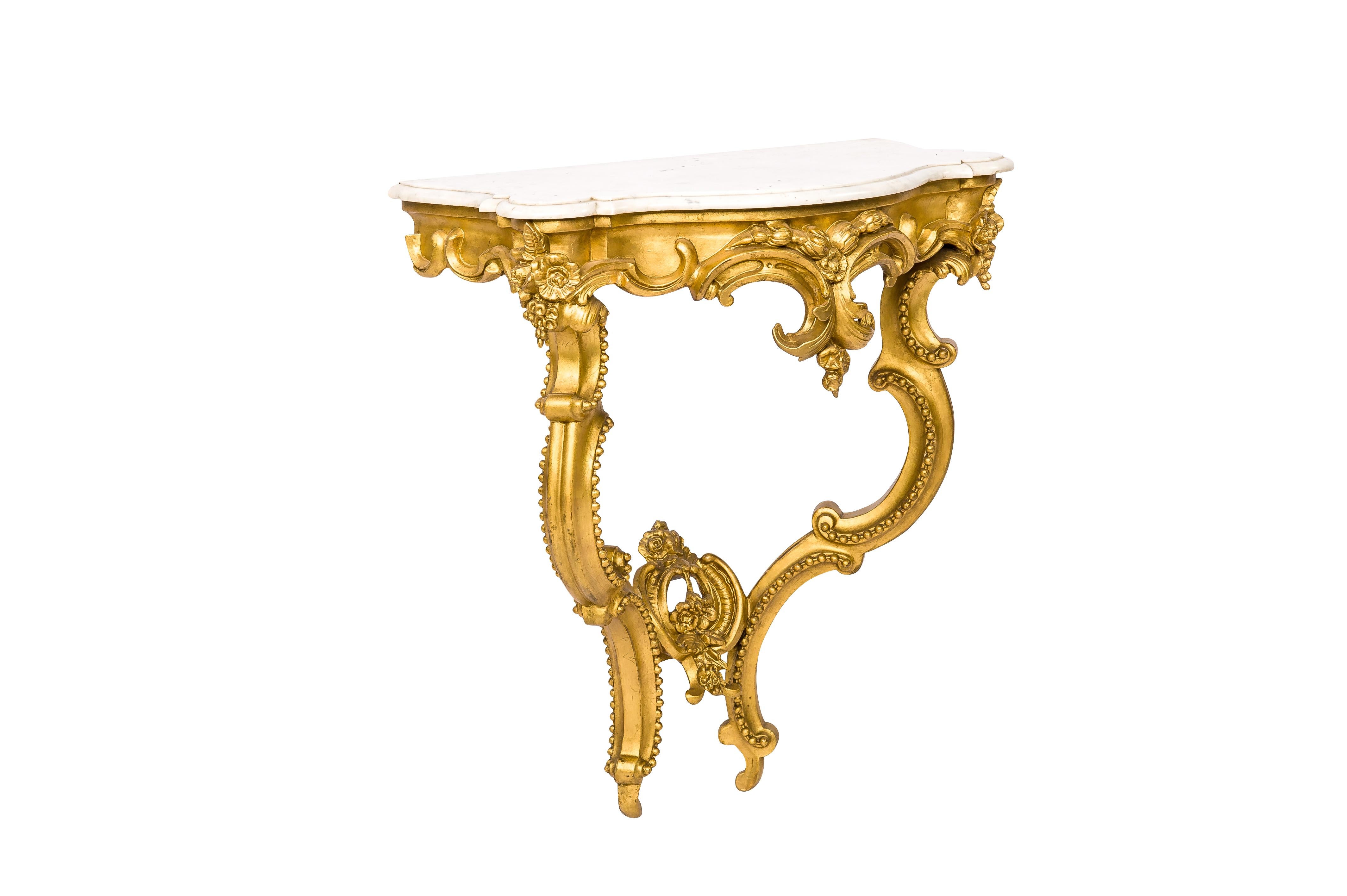 This elegant Baroque console table or hall table was made in Southern France, around 1870. The table has a solid pine base smoothened with gesso. The table has two legs built up from C scrolls and it is decorated with classic pearl beading following