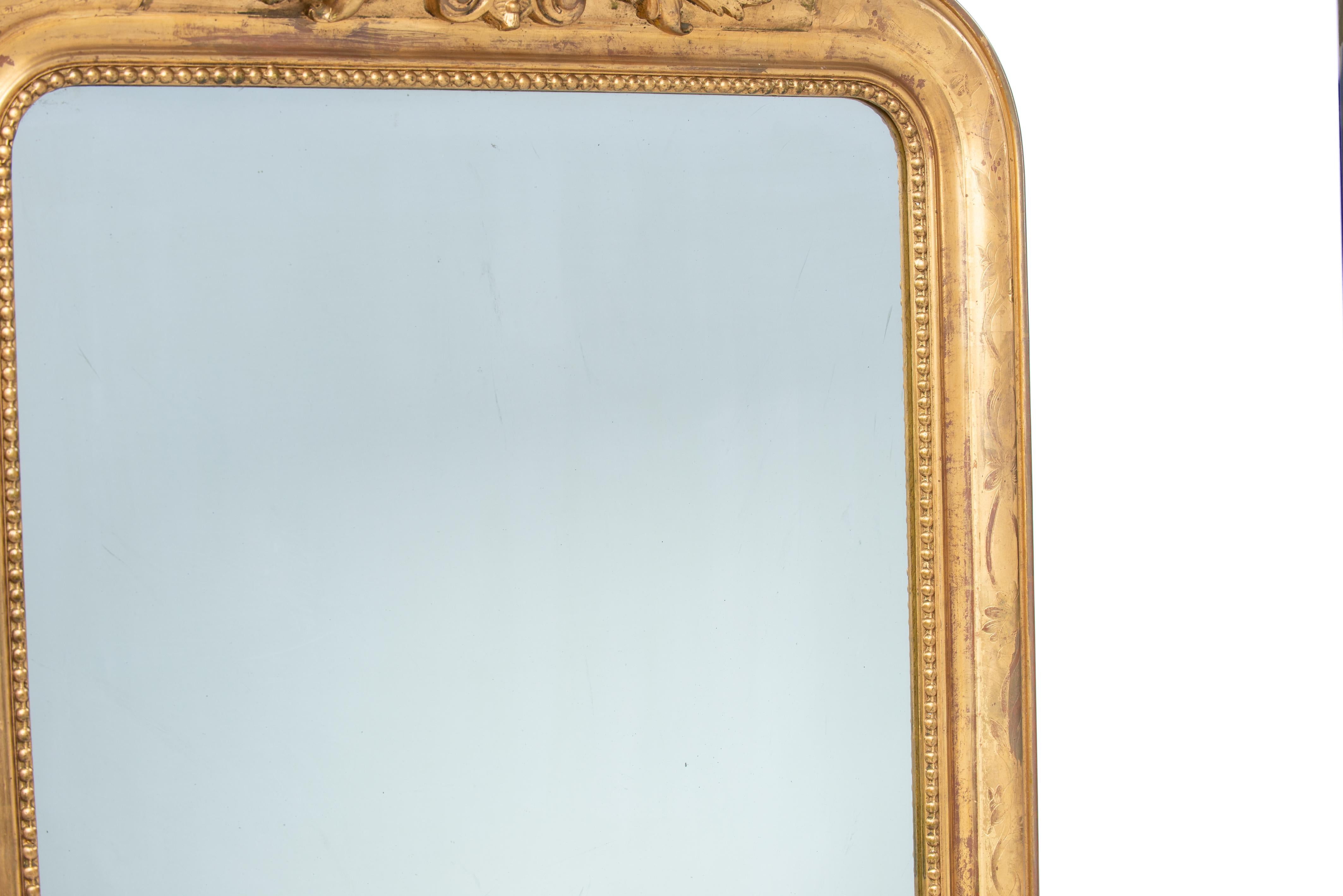 Gilt Antique 19th-century French gold leaf gilt Louis Philippe mirror with crest