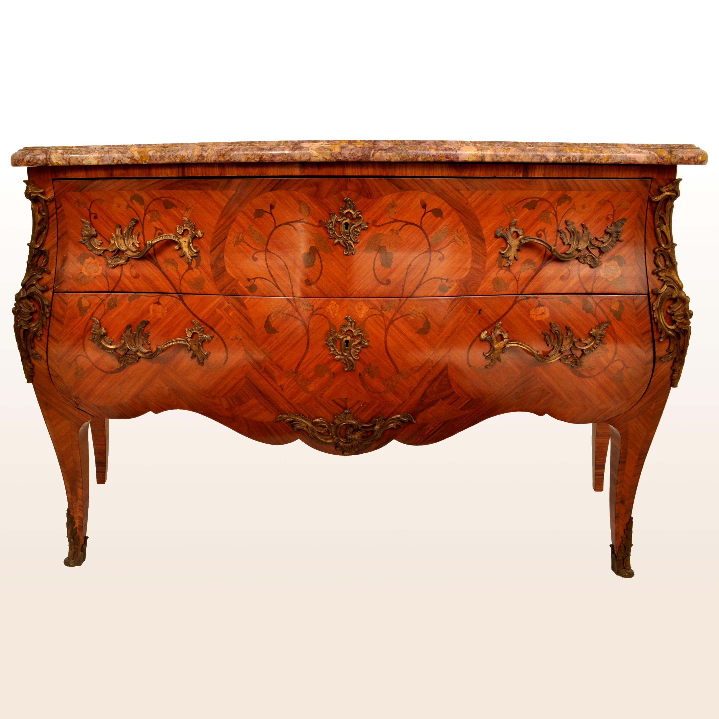 A spectacular antique French marble top Louis XV style marquetry walnut bombe shaped commode, circa 1880. 
The two drawer commode having a substantial variegated marble top, the chest made of cross-banded walnut of bombe form and sumptuously inlaid