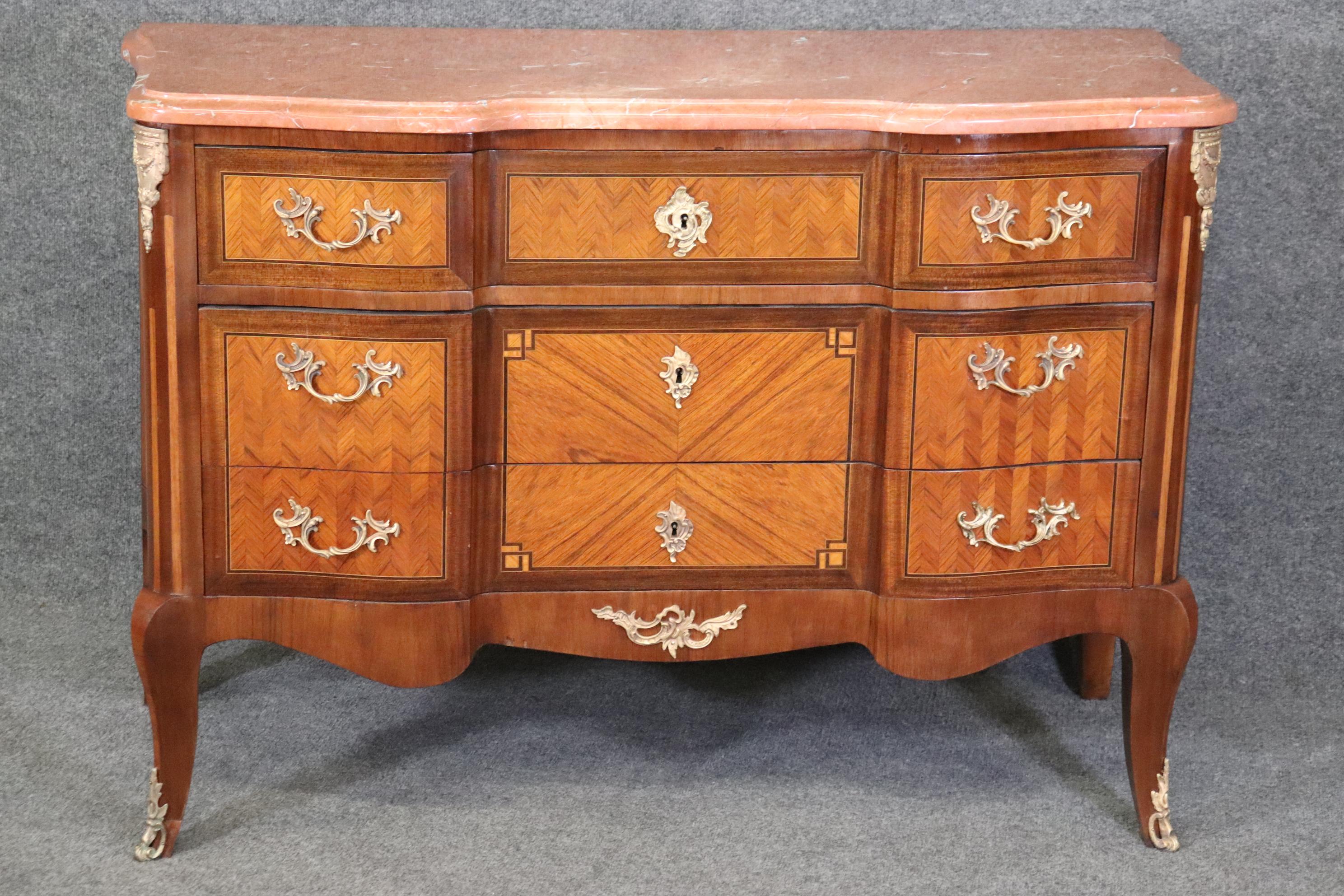 Dimensions: Height: 34 1/2 in Width: 50 1/2 in Depth: 21 1/4 in 

This antique 19th century French Louis XV Rococo style marble top commode, chest of drawers is a great example of quality French furniture! If you look at the photos provided, you