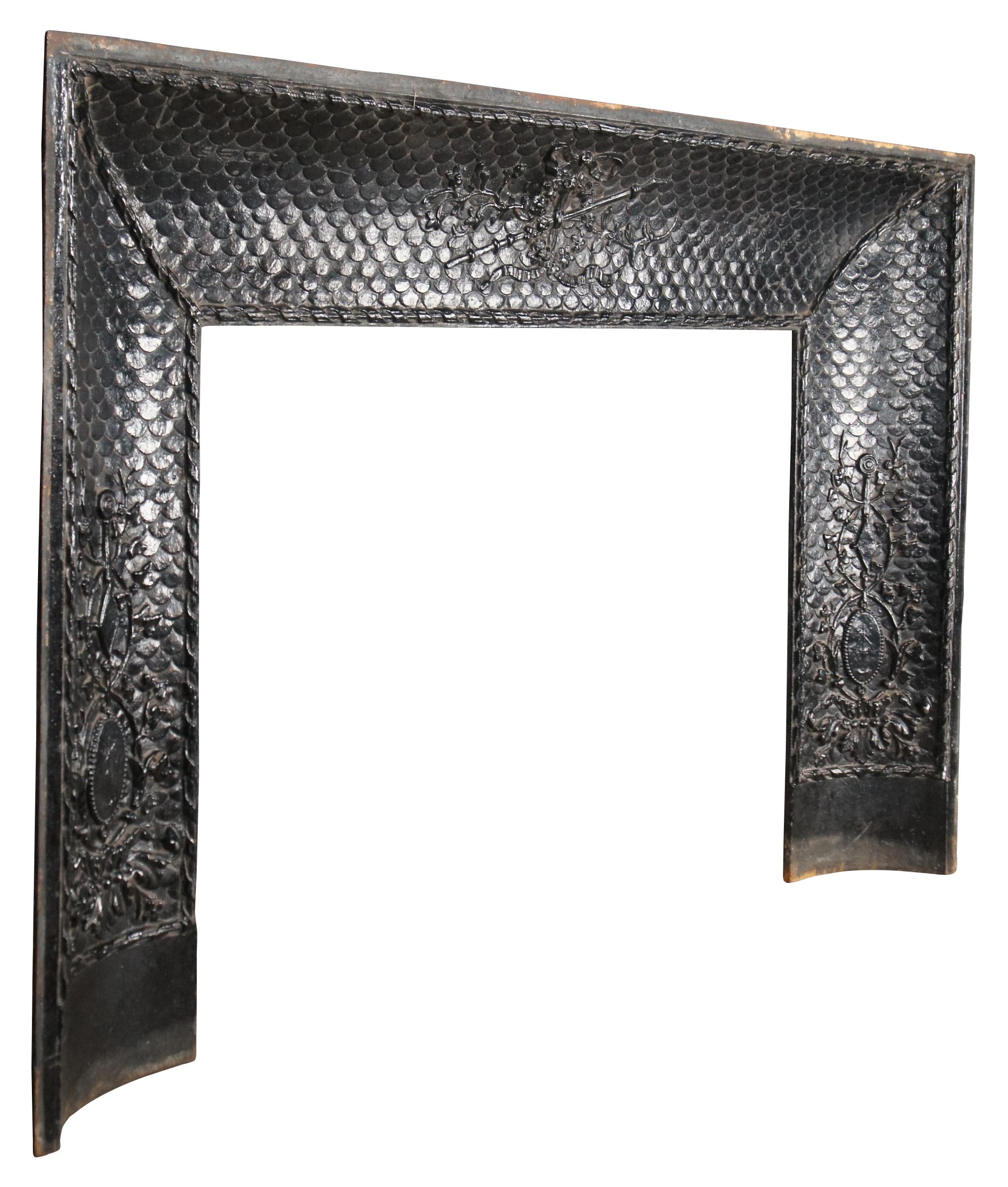 A rare and impressive mid 19th century French cast iron fireplace insert or surround. Features a concave form with meticulous detail. The insert is characterized by a field of animal scales giving off a leather like feel. At the center is a floral