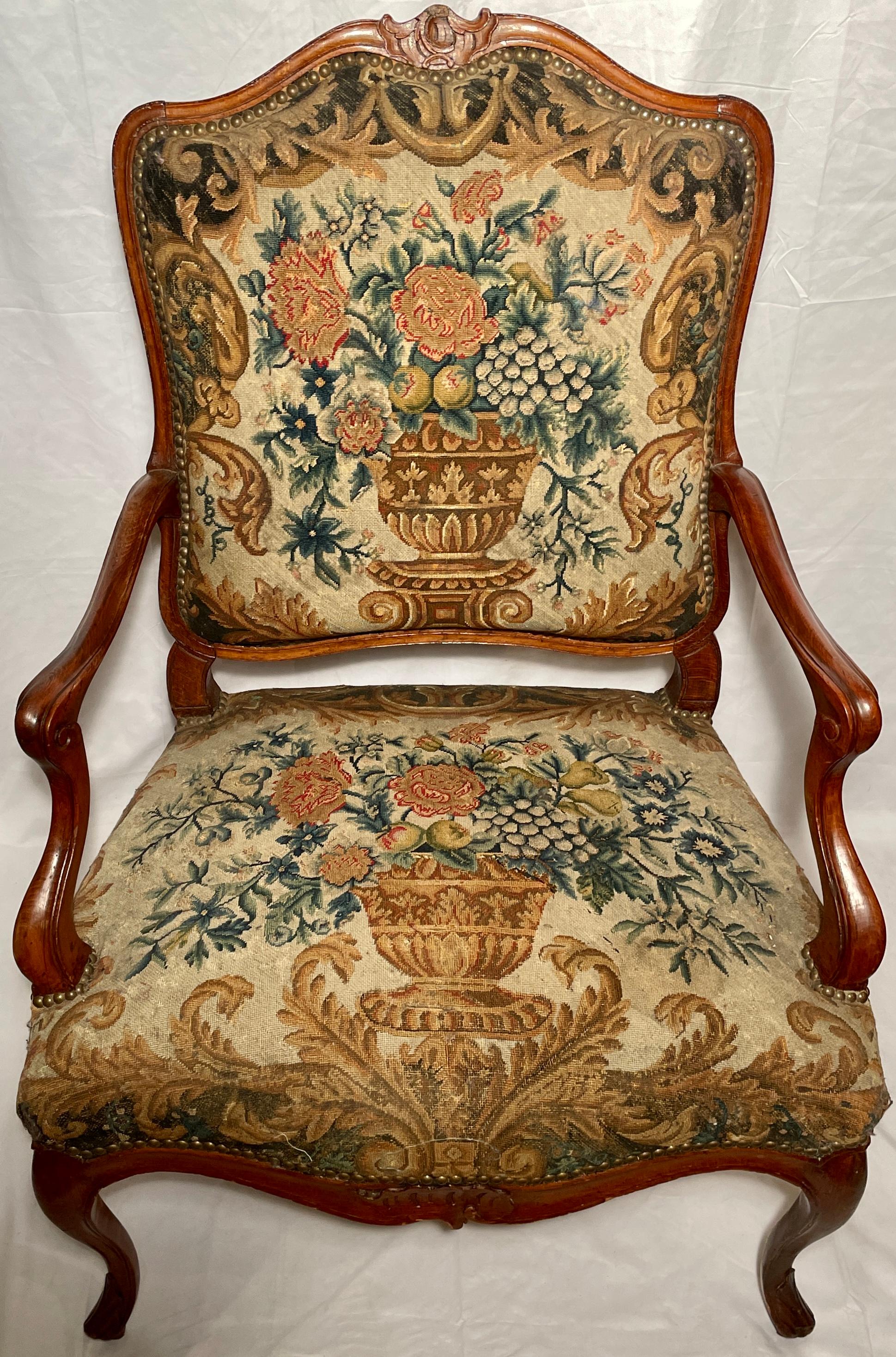 Antique 19th century French carved walnut needlepoint armchair. 