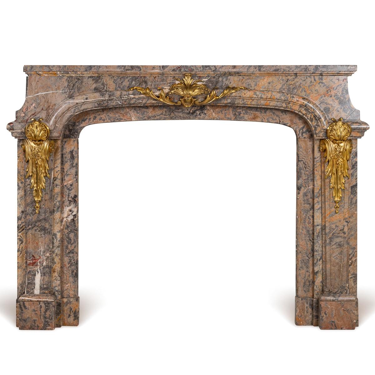 Antique 19th Century Louis XV Rococo style fireplace in Caravaggio marble, mounted with ormolu floral spay mounts. This superb fireplace adds elegance and sophistication to any interior, working well in a traditional, mid-century or even modern