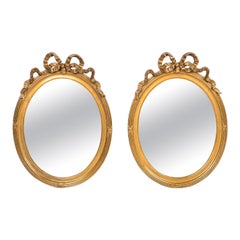 Antique 19th Century French Pair of Oval Gold Gilt Mirrors with Bow Tied Ribbon