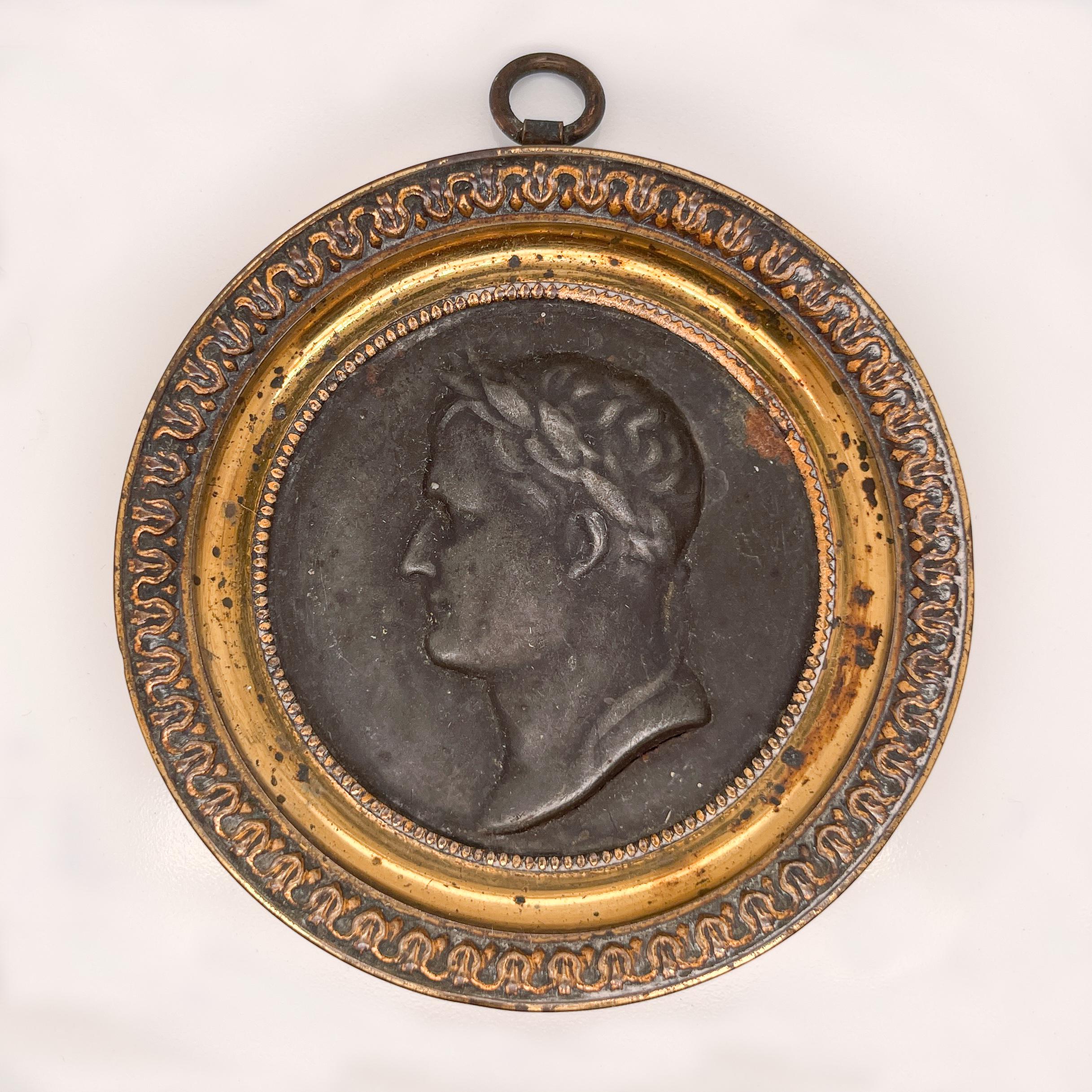 A fine antique French Napleonic rondel.

With an image of Napoleon as Caesar.

The stamped tin rondel is mounted in a thin gilt bronze or brass frame. 

With an integral loop to the top for hanging. 

Simply a fine Napoleon II period