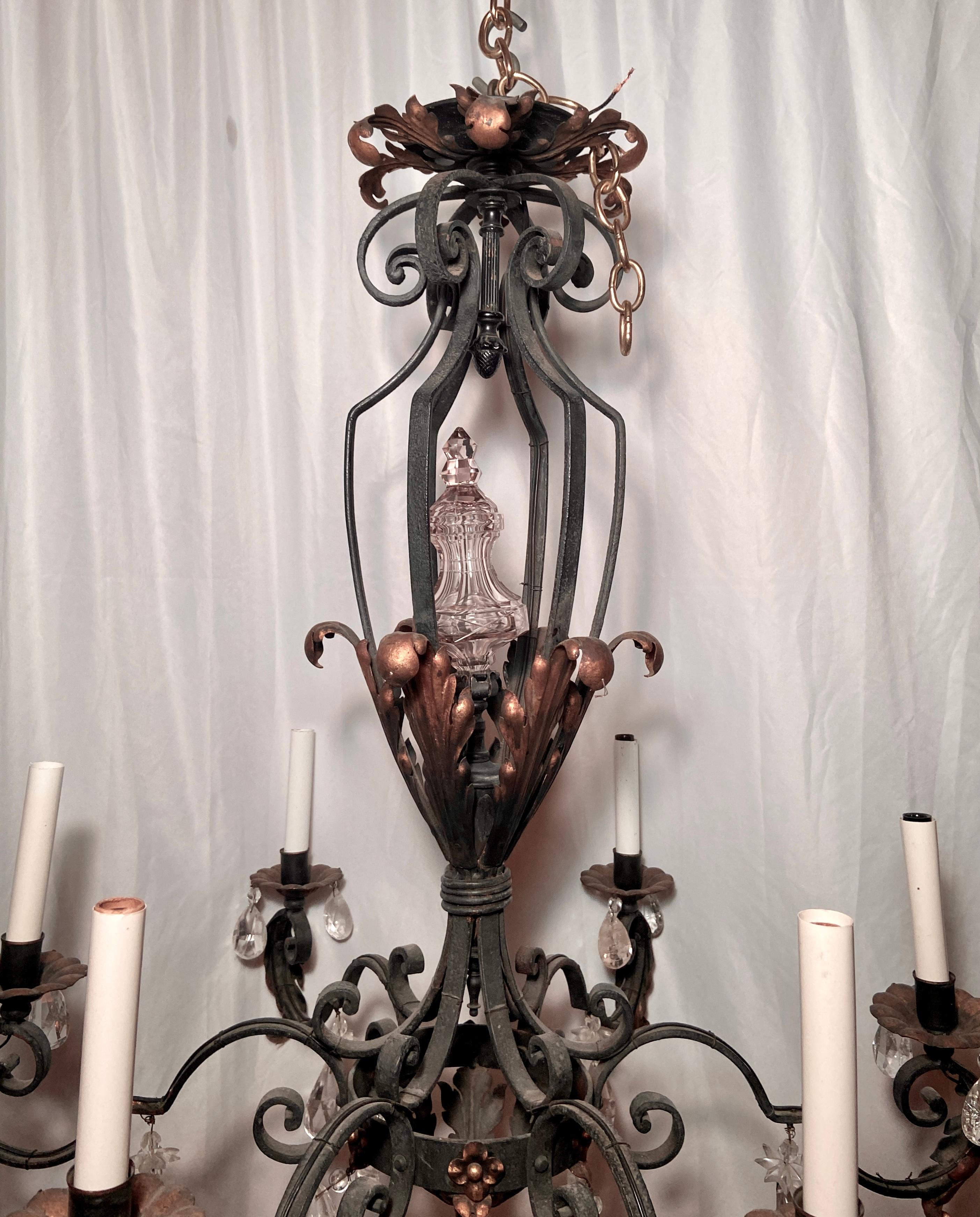 Antique 19th century French provincial iron and crystal chandelier.