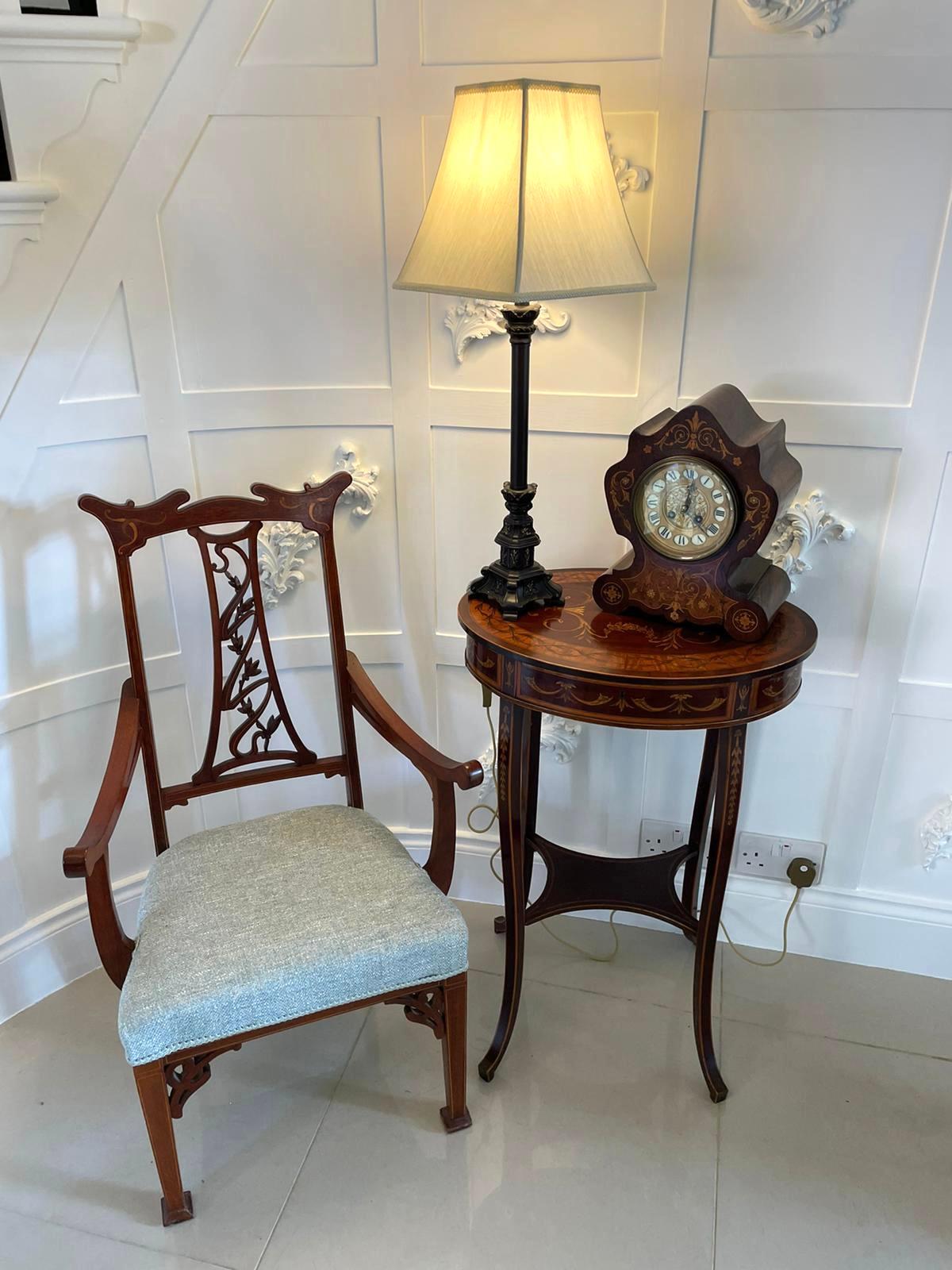 Antique 19th century French antique rosewood marquetry inlaid eight day mantel clock with a beautiful shaped marquetry inlaid case with an eight day movement boasting a delightful Roman numeral dial.

A quaint piece in good working