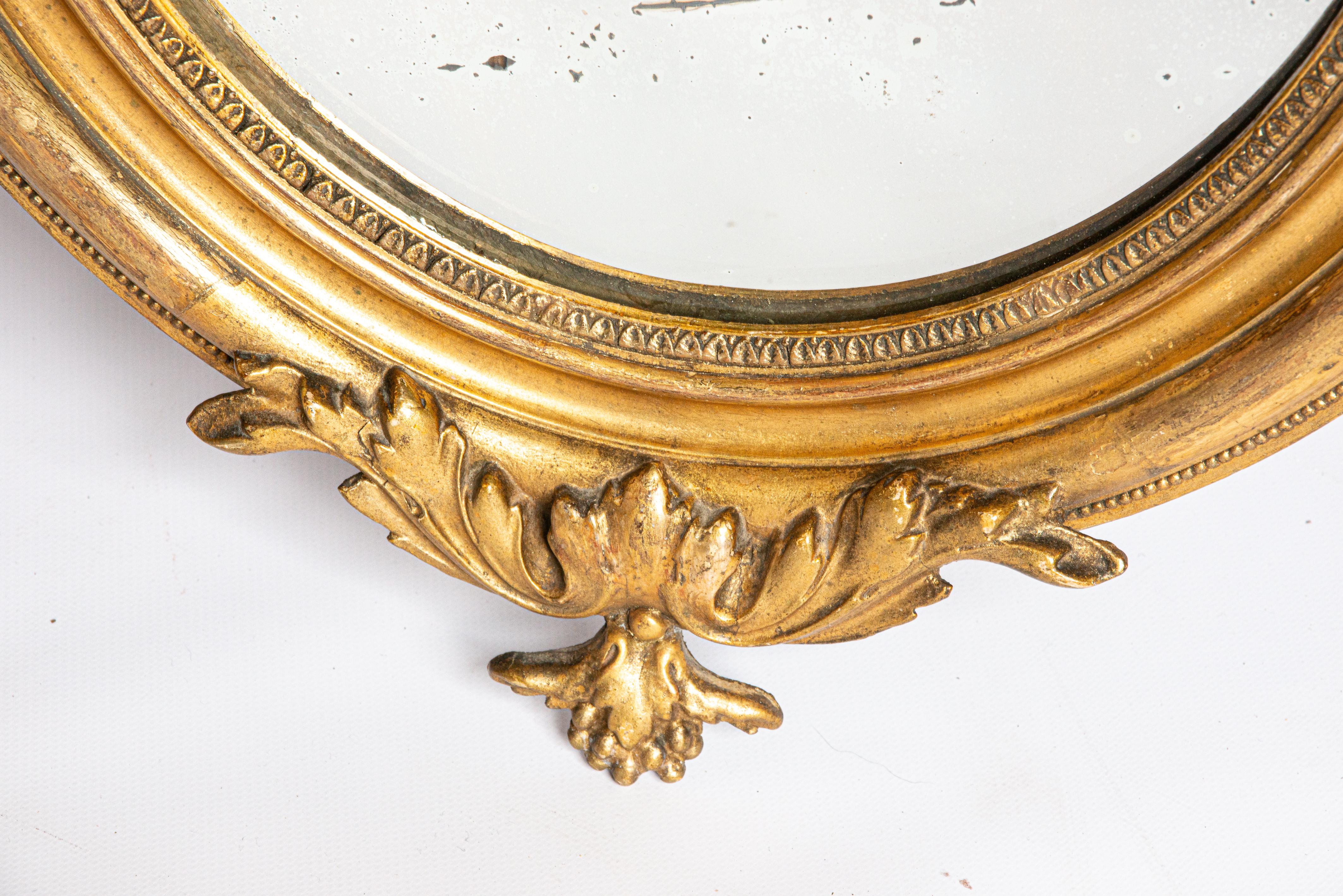 Gesso Antique 19th Century French Small Oval Gold Gilt Louis Philipe Mirror with Crest For Sale