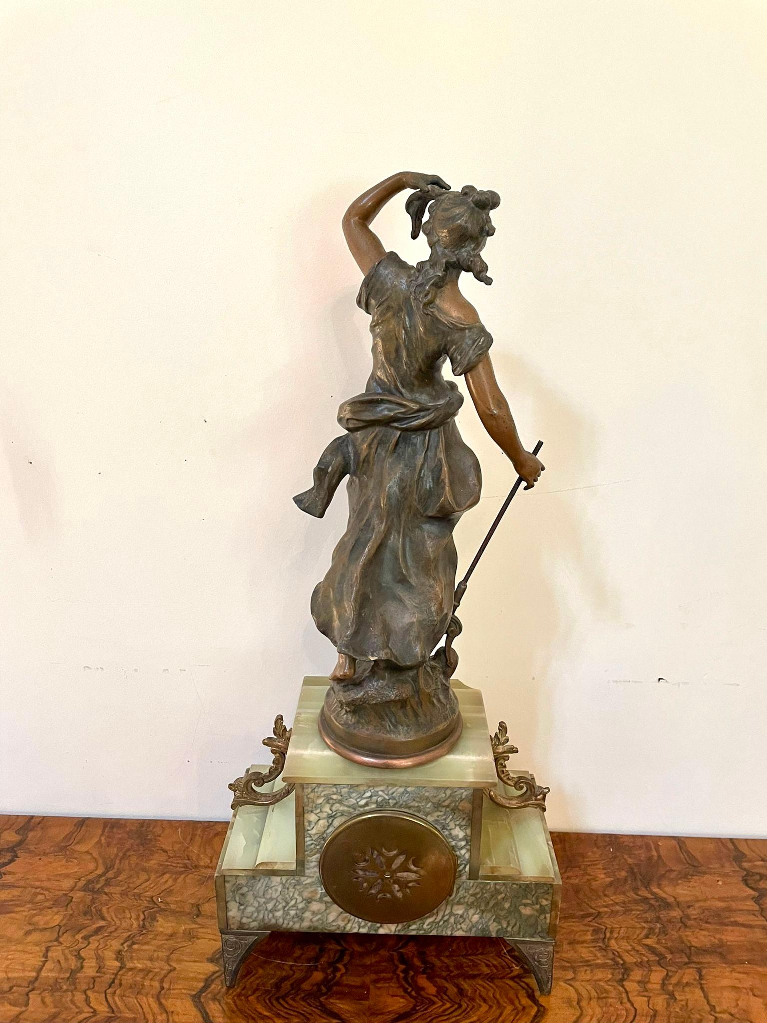Antique 19th century French spelter and onyx clock having a quality painted dial, original hands and eight day movement striking on the hour and half hour on a bell. A beautiful quality onyx case surmounted by a spelter figure of amphitrite after