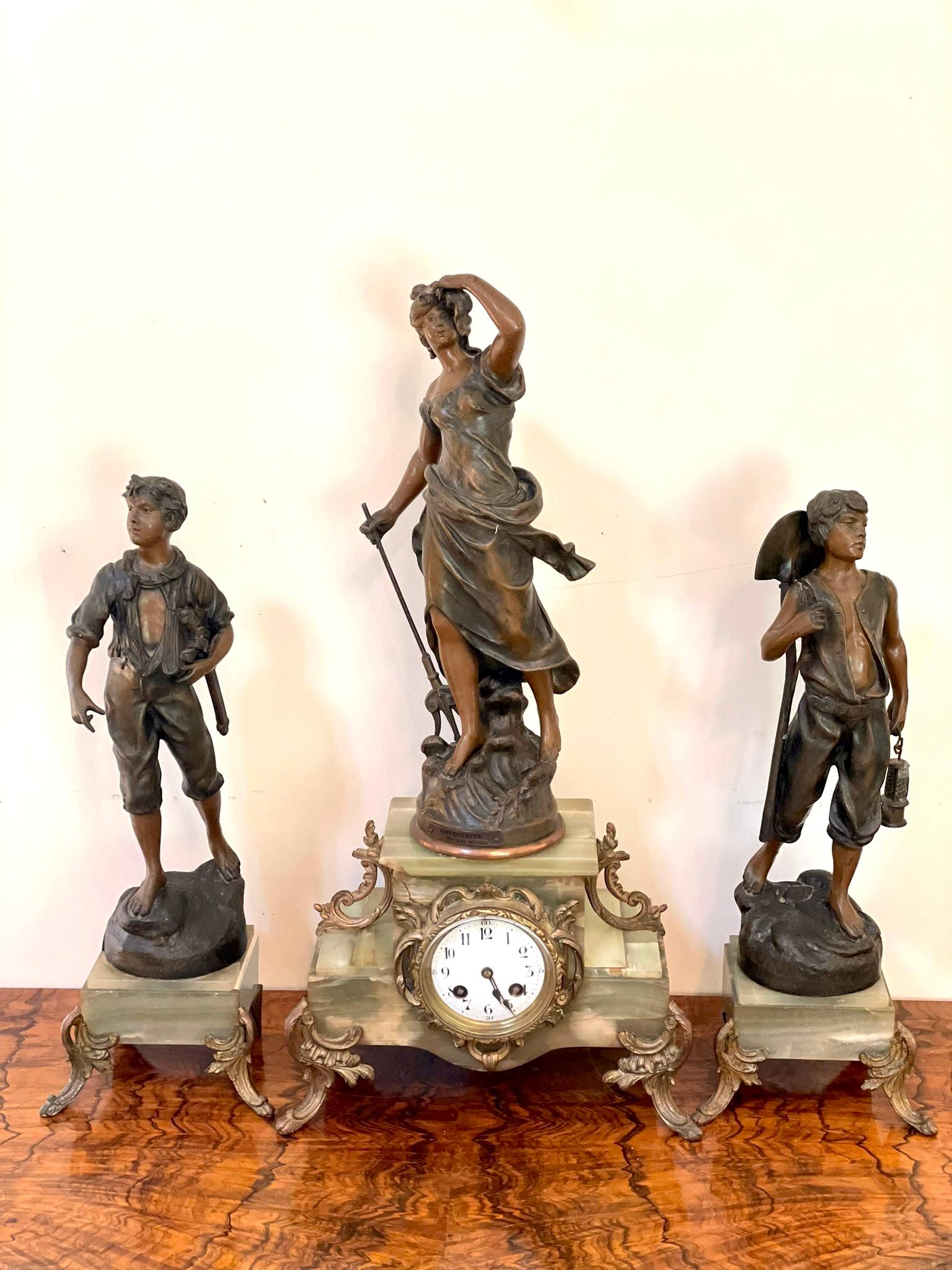 Antique 19th century French spelter and onyx three piece clock garniture having a quality painted dial, original hands and eight day movement striking on the hour and half hour on a bell. A beautiful quality onyx case surmounted by a spelter figure