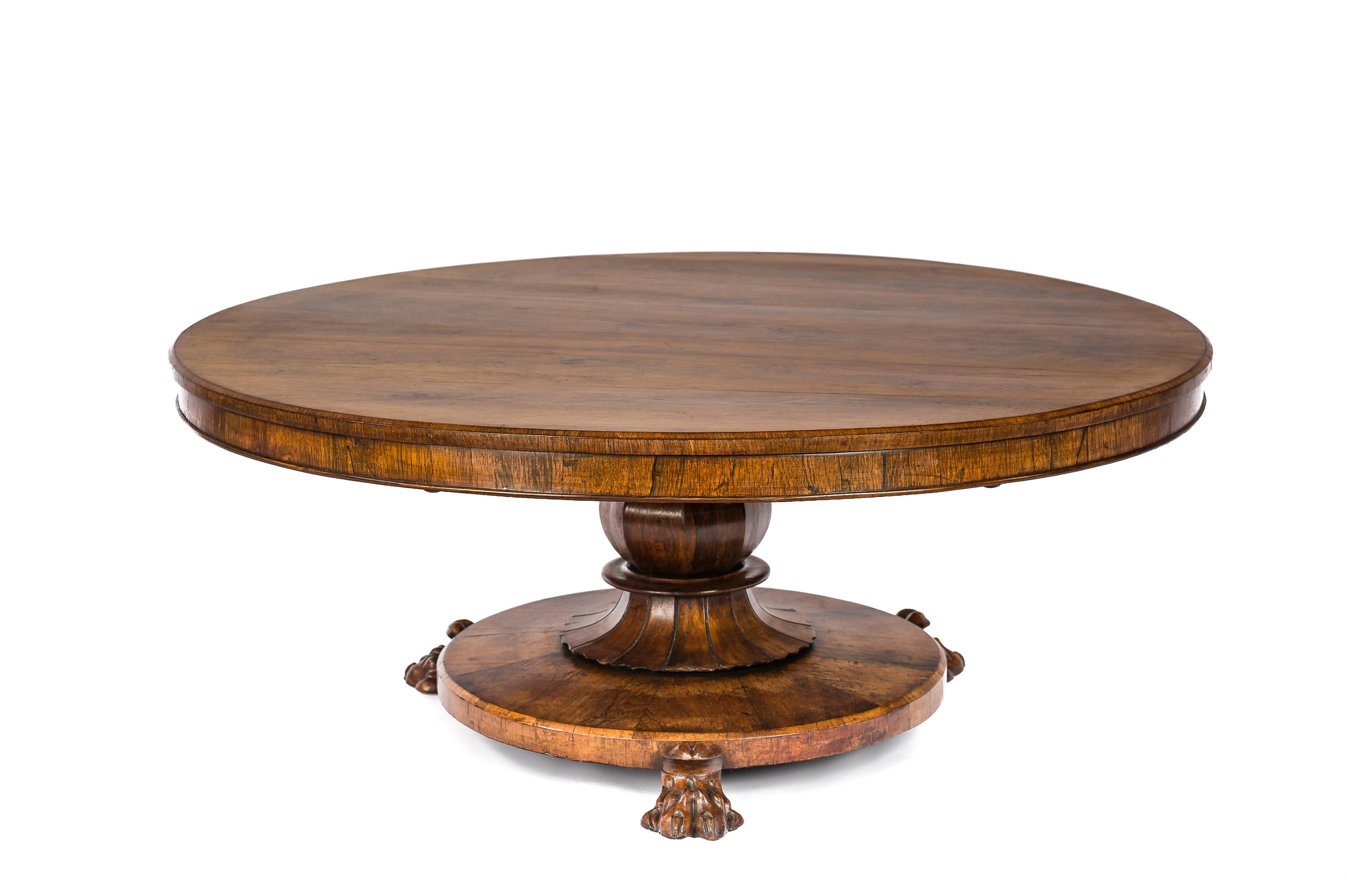 This beautiful round coffee table was made in France in the late 19th century, circa 1880. The top was veneered with exceptional walnut wood with a fantastic grain pattern. The veneer was laid in an “open book” manner and is therefore symmetrical. 