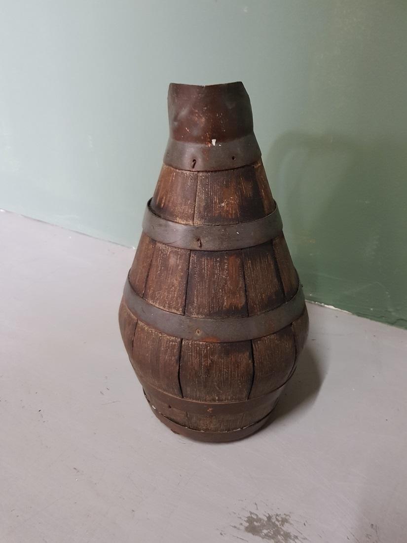 Antique French wine pitcher made of wood and copper bands, it's in a used condition but not broken, 19th century. 

The measurements are,
Depth 18 cm/ 7 inch.
Width 15 cm/ 5.9 inch.
Height 27 cm/ 10.6 inch.