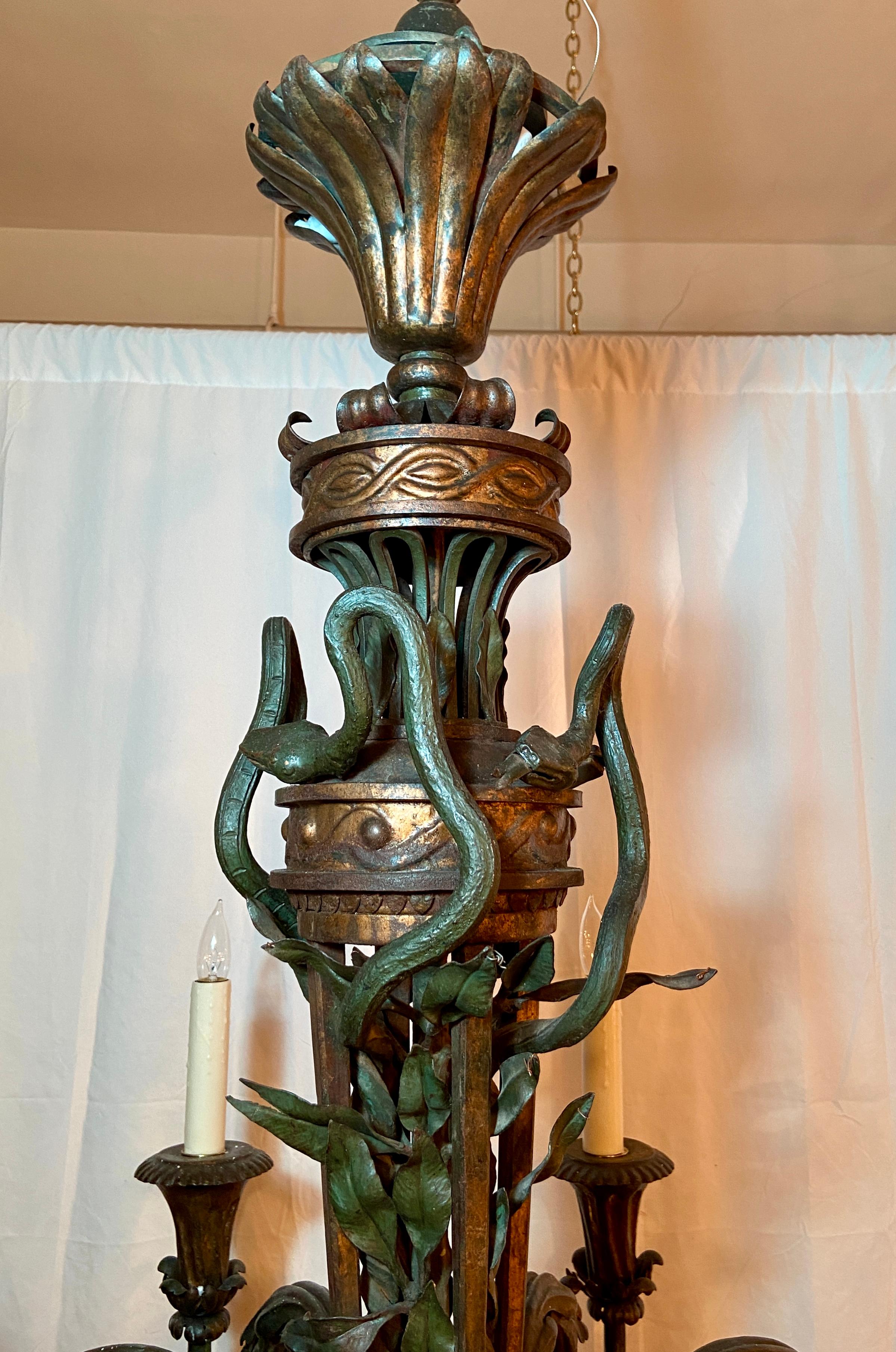 Antique 19th century French wrought iron chandelier with figural snakes, circa 1840.