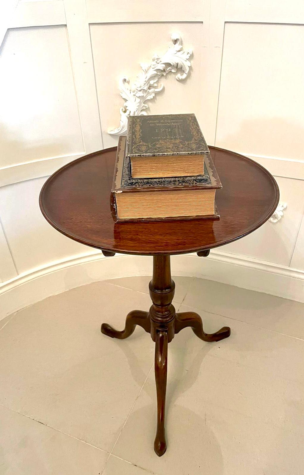 Antique 19th Century George III mahogany dish top tripod table having a lovely quality mahogany dish top supported by an elegant turned shaped column and raised on three attractive shaped cabriolet legs with pad feet.

An attractive example with a