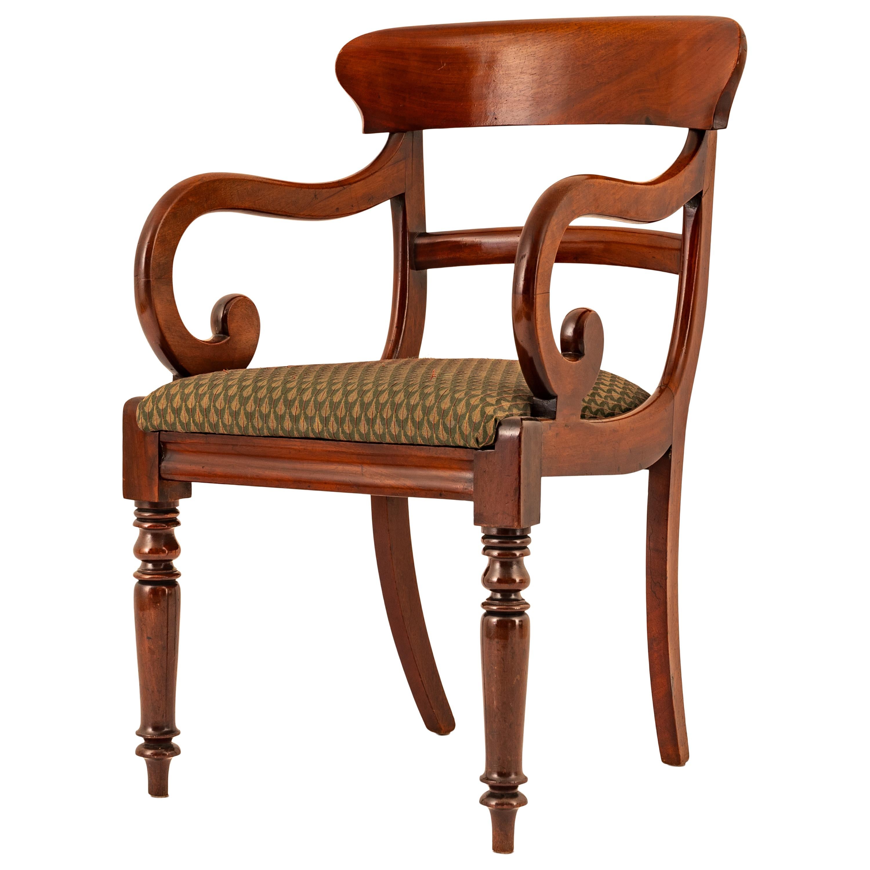 A good antique Georgian Regency desk library chair, circa 1820.
This very stylish chair is made from the finest solid Cuban mahogany, the chair has a substantial back splat support with a curved rail below, the chair having extravagant curved