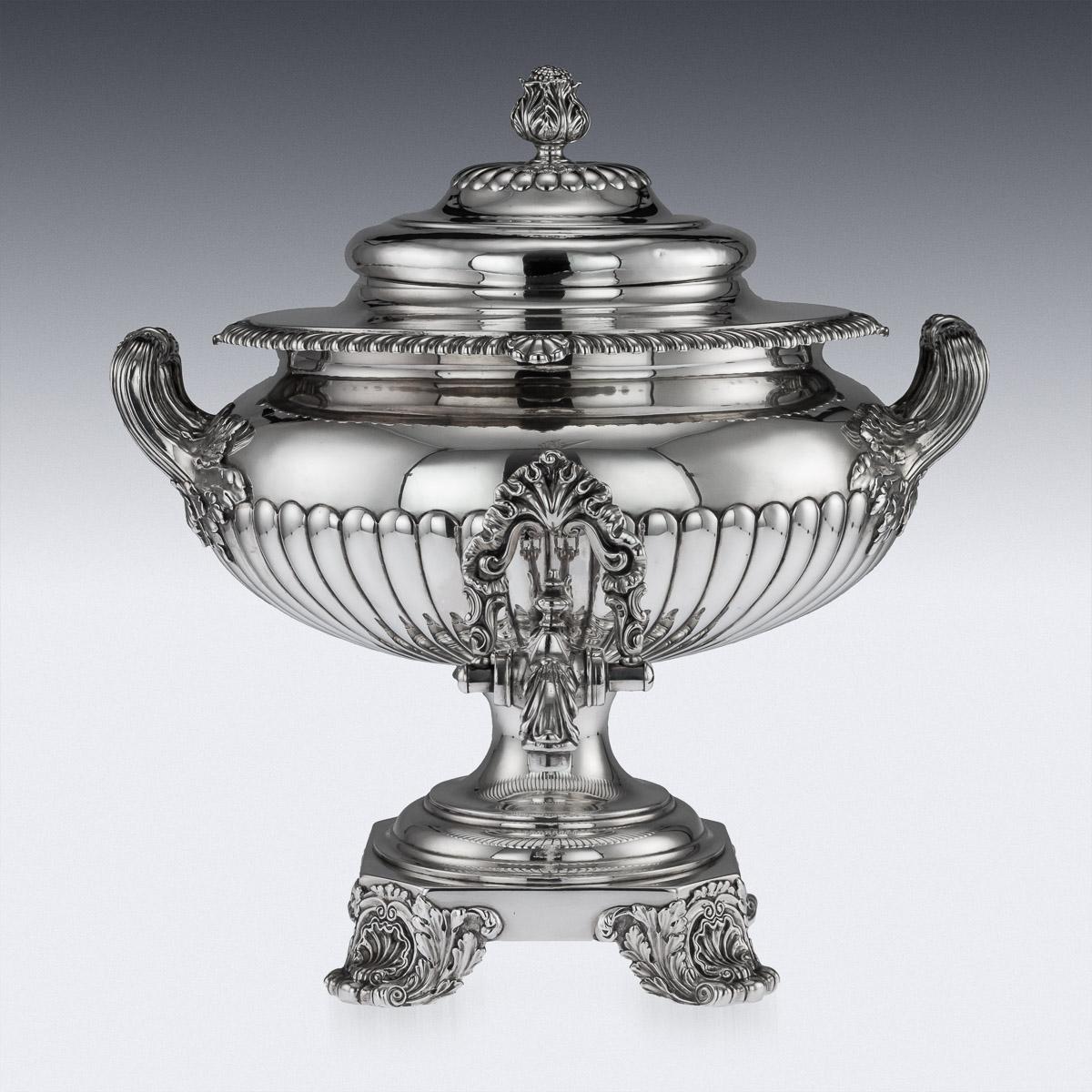 Description

Antique 19th Century Georgian exceptional solid silver hot water samovar, of squashed bulbous form with reeded decoration, on a square base, standing on cast scroll and shell feet, applied with twin acanthus leaf handles, a hot water
