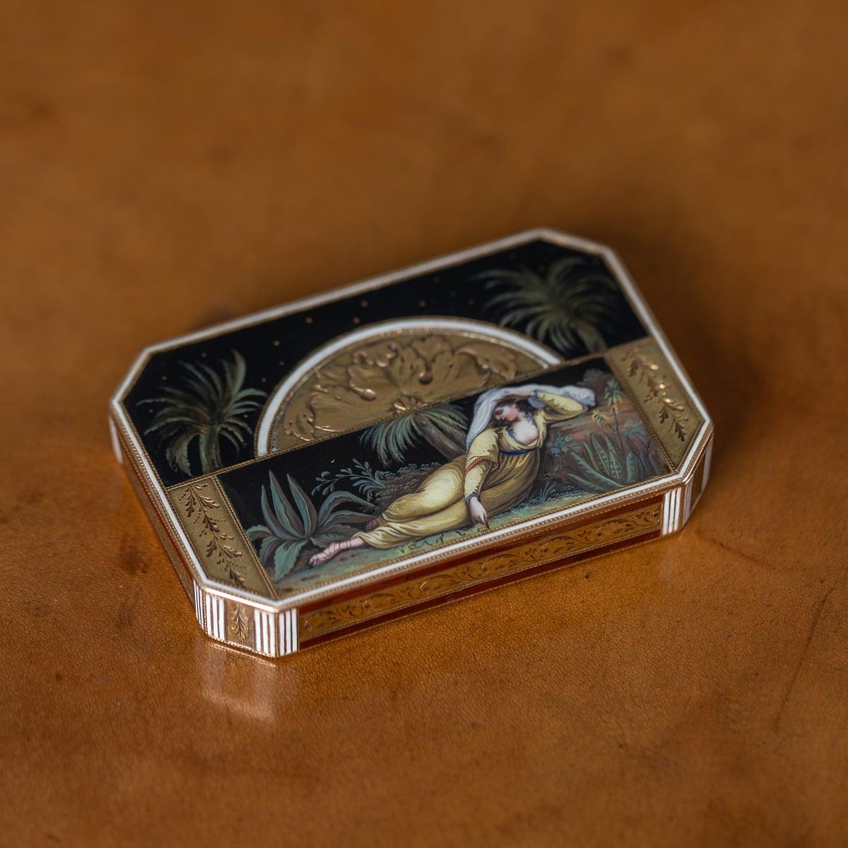 Antique early 19th Century German 18k gold & enamel snuff box, of rectangular form with cut corners, featuring a lid adorned with intricate decorations divided lengthwise. The upper portion of the lid is exquisitely enameled *en plein* with a scene