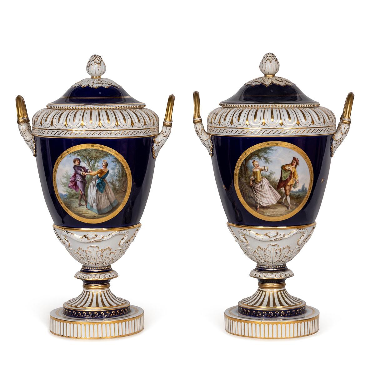 Antique late 19th Century pair of A Berlin KPM porcelain vases with covers, showcasing exquisite craftsmanship. Marked with a underglaze blue scepter and a crowned orb above 