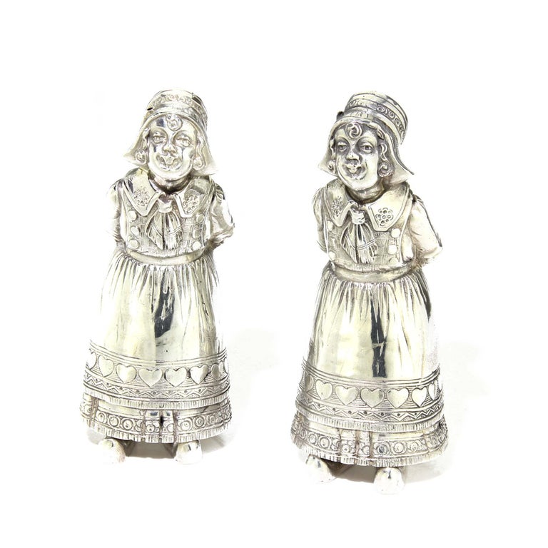 Antique 19th Century German or Dutch pair of 930. silver Salt & Pepper shakers in a form of woman with traditional costumes
Made in The Netherlands or Germany, possibly Hanau
Fully hallmarked.

Dimensions - 
Length : 5 cm 
Width : 4.5