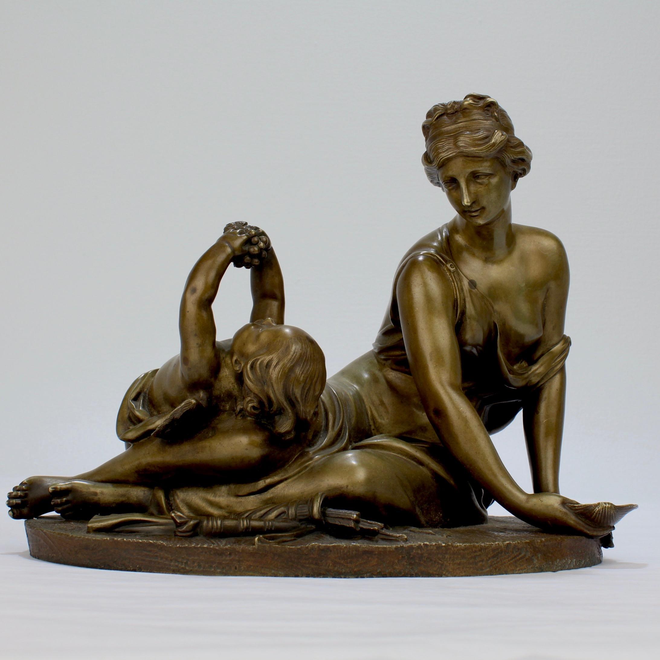 A wonderful bronze of a seated Venus and Cupid.

Modeled with a recumbent Venus attended by Cupid on an oval plinth in the manner of Albert-Ernest Carrier-Belleuse. 

With finely cast detail and a rich golden patina. 

Measures: Width: ca. 10