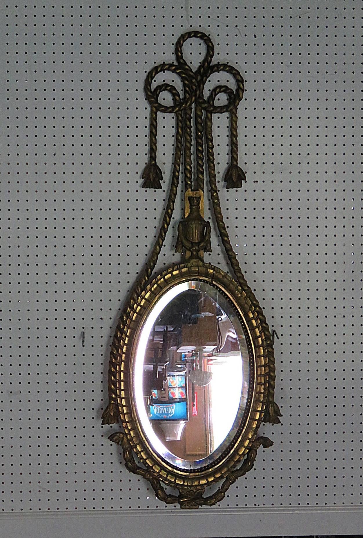 Antique 19th century giltwood mirror with beveled glass.