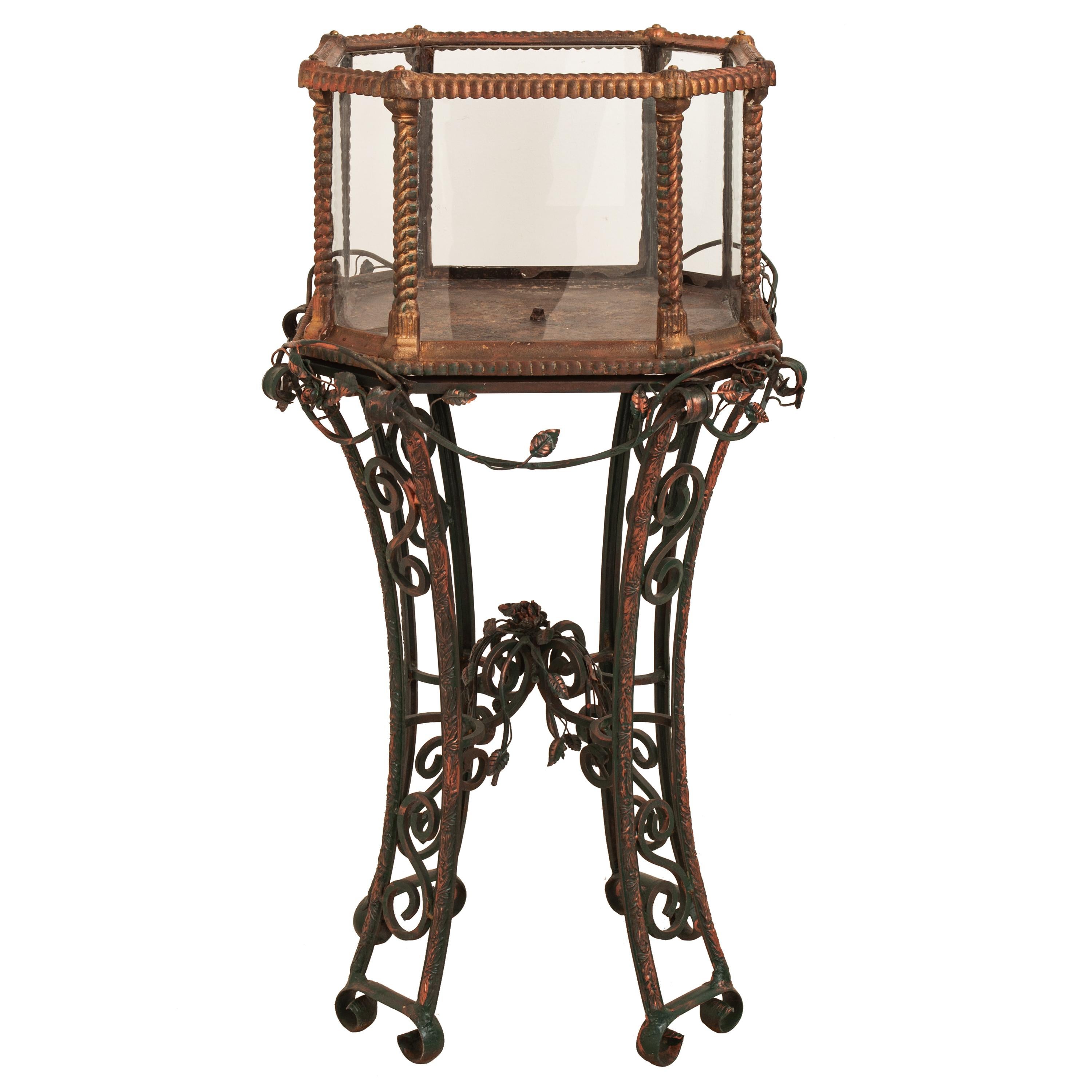 A rare antique gilded cast and wrought iron Rococo Revival terrarium/aquarium on stand, attributed to J. W. Fiske & Co., NY, circa 1880.
The two section terrarium having a gilt cast iron octagonal top, glazed on each side and having cast 'ropework'