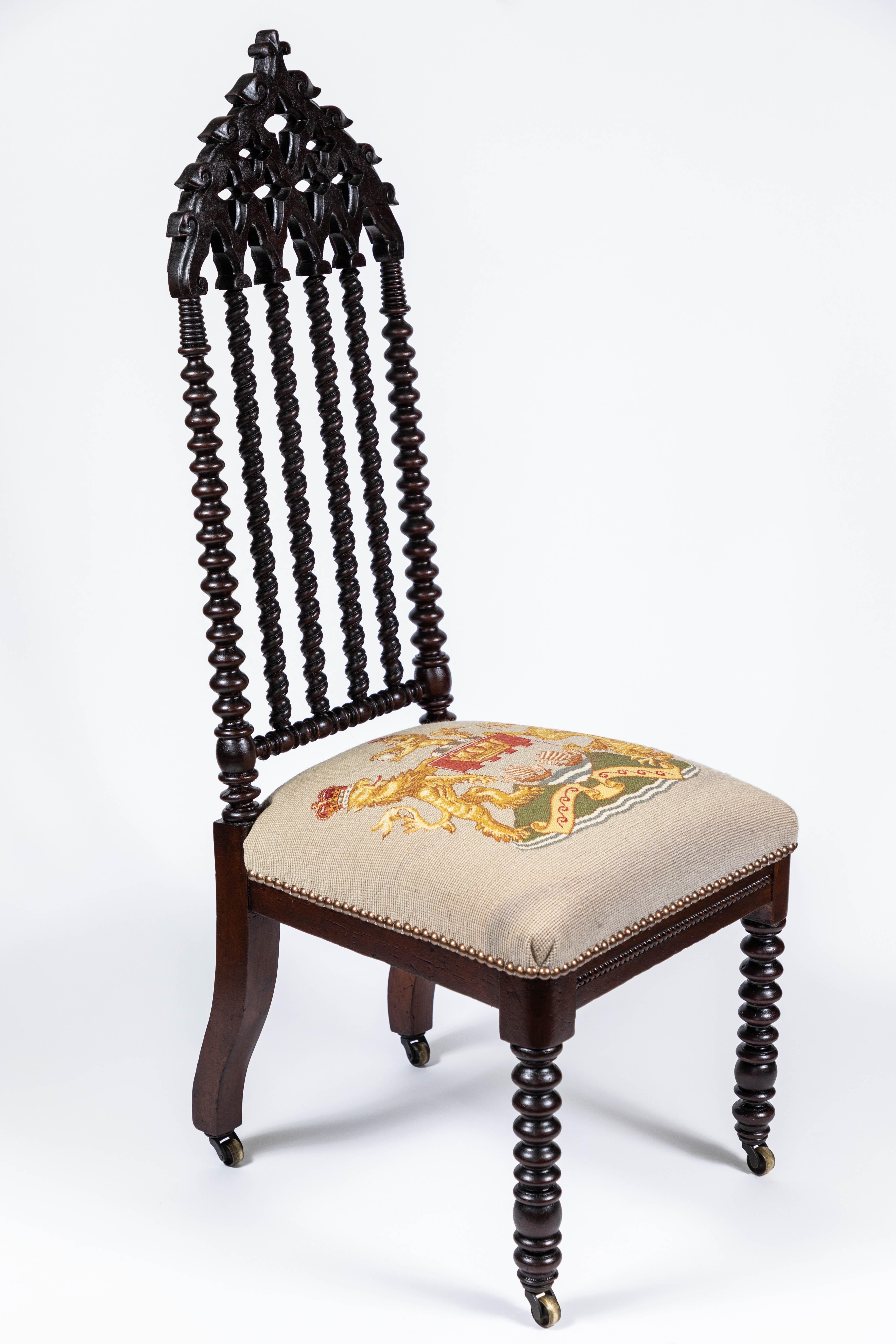 Antique 19th century Gothic Revival style chair with seat newly upholstered in a vintage needlepoint with crest & lions.