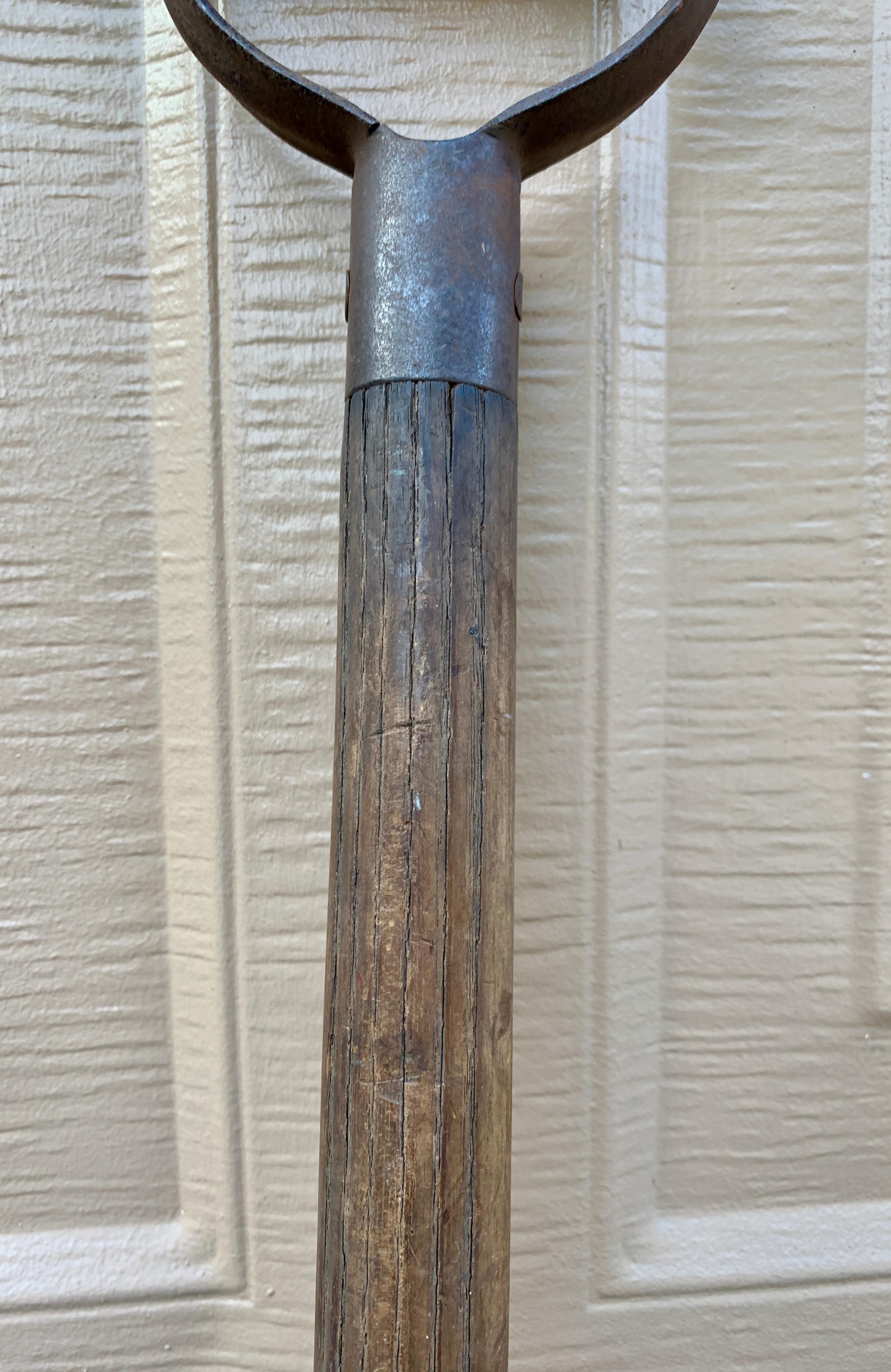 antique shovel with wooden handle