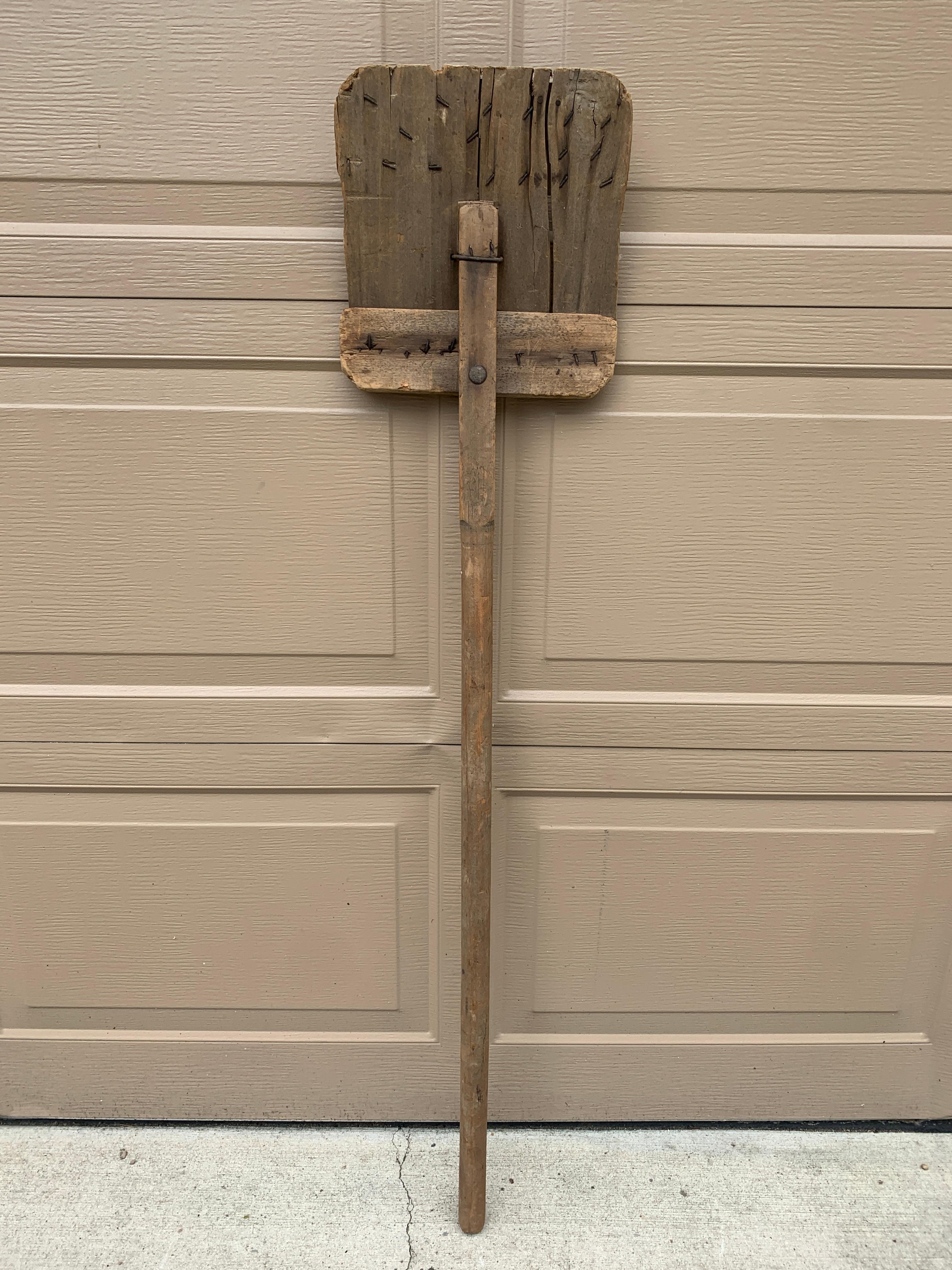 A beautiful antique rustic, farmhouse, or country wooden hand made grain shovel. This would be ideal for an installation on a large wall on a custom wall mount.

USA, Circa late 19th century

Measures: 11.25