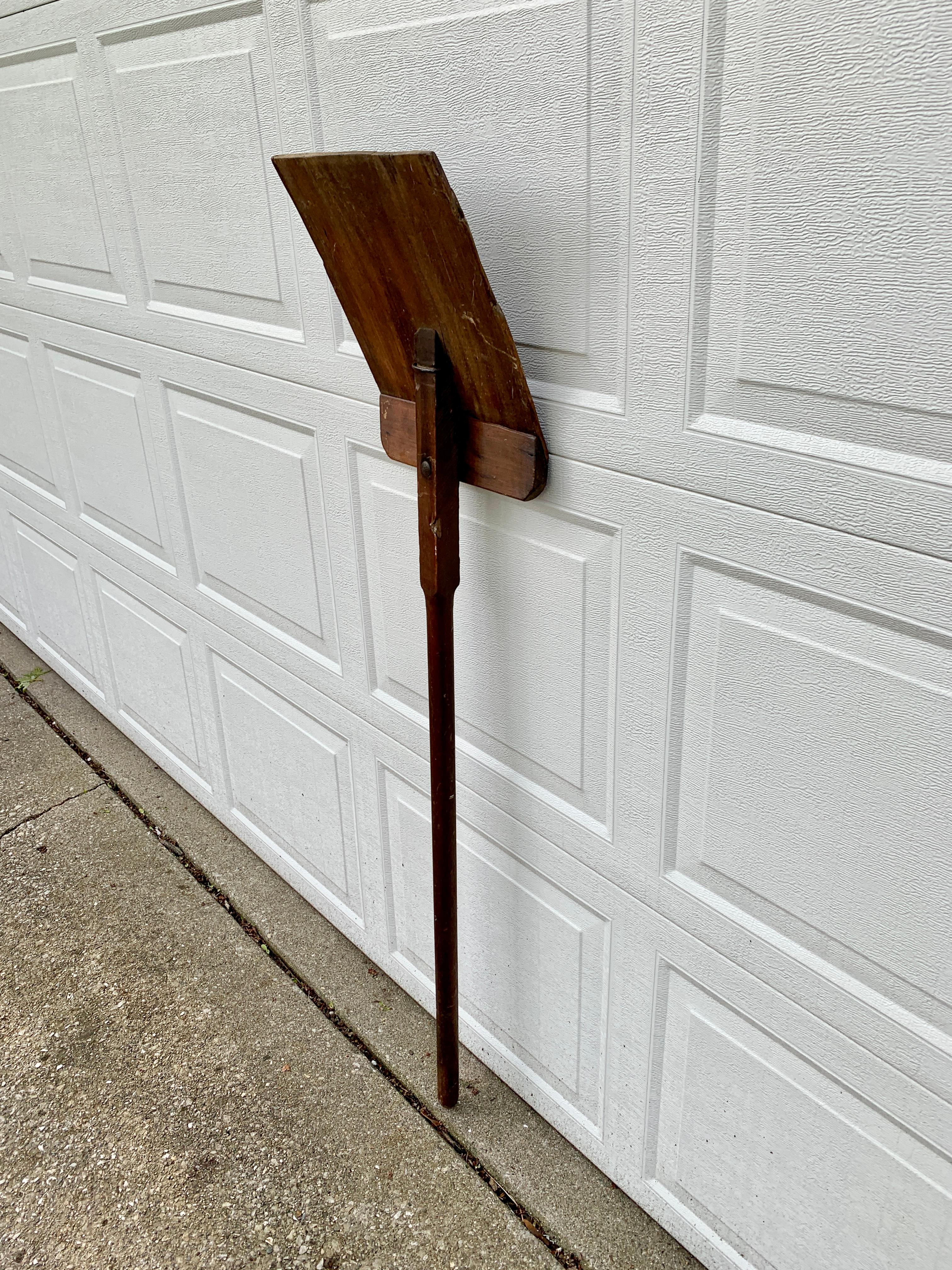 antique shovel with wooden handle