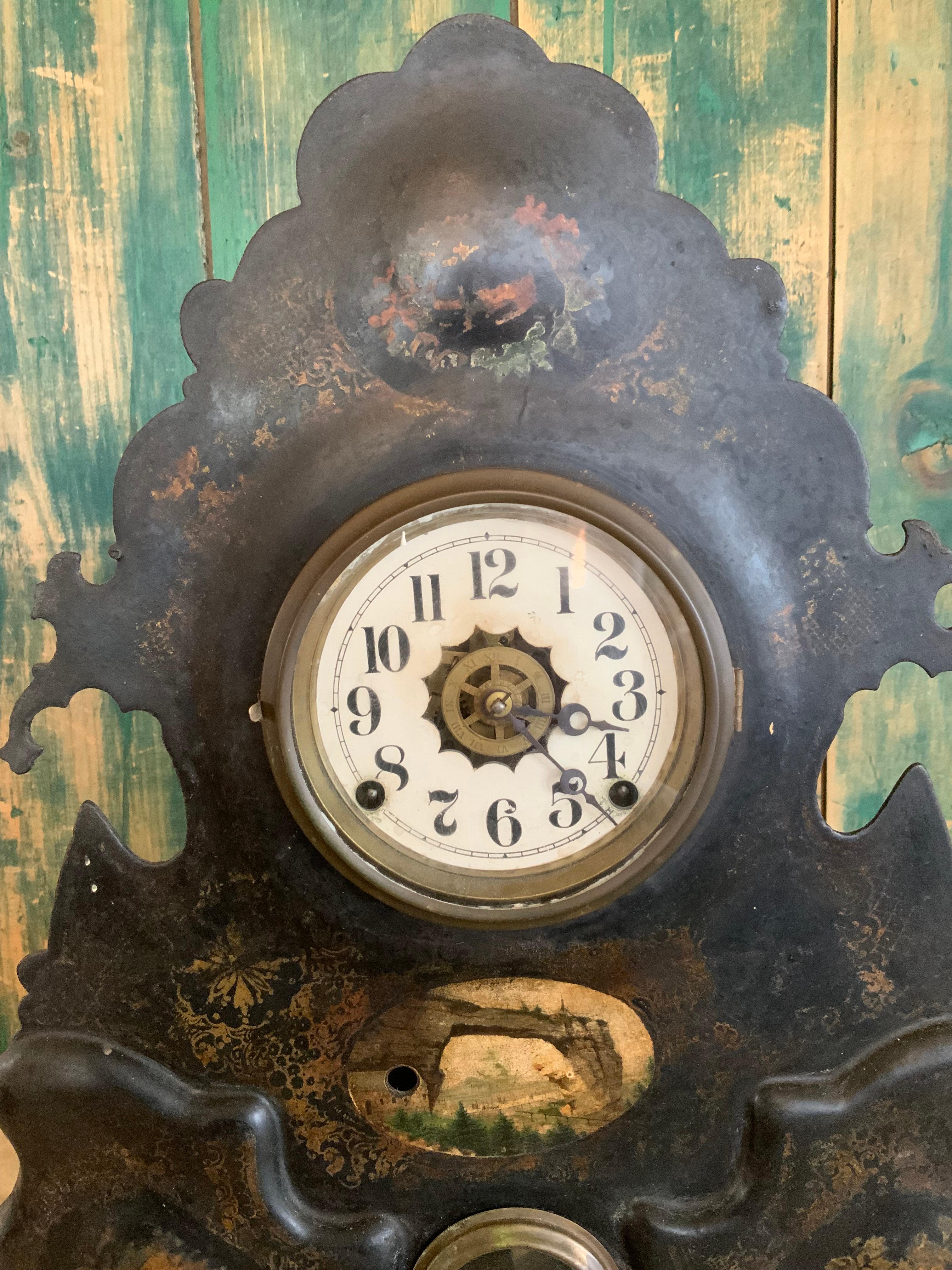 a very charming late 19th century cast iron mantel clock, with much of its original hand painted decoration, and a working mechanism, including chimes. 

wonderful scale and details, very well preserved.