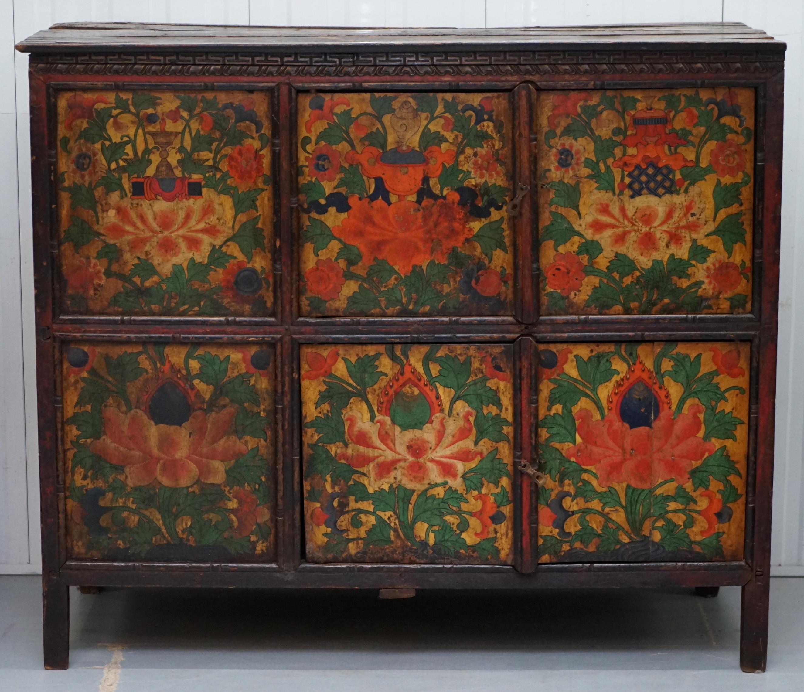 We are delighted to offer for sale this stunning 19th century Tibetan hand paint alter cabinet depicting birds and flowers

These cabinets are constructed from cedar or pine and decorated in the traditional Tibetan colours. They were often used as