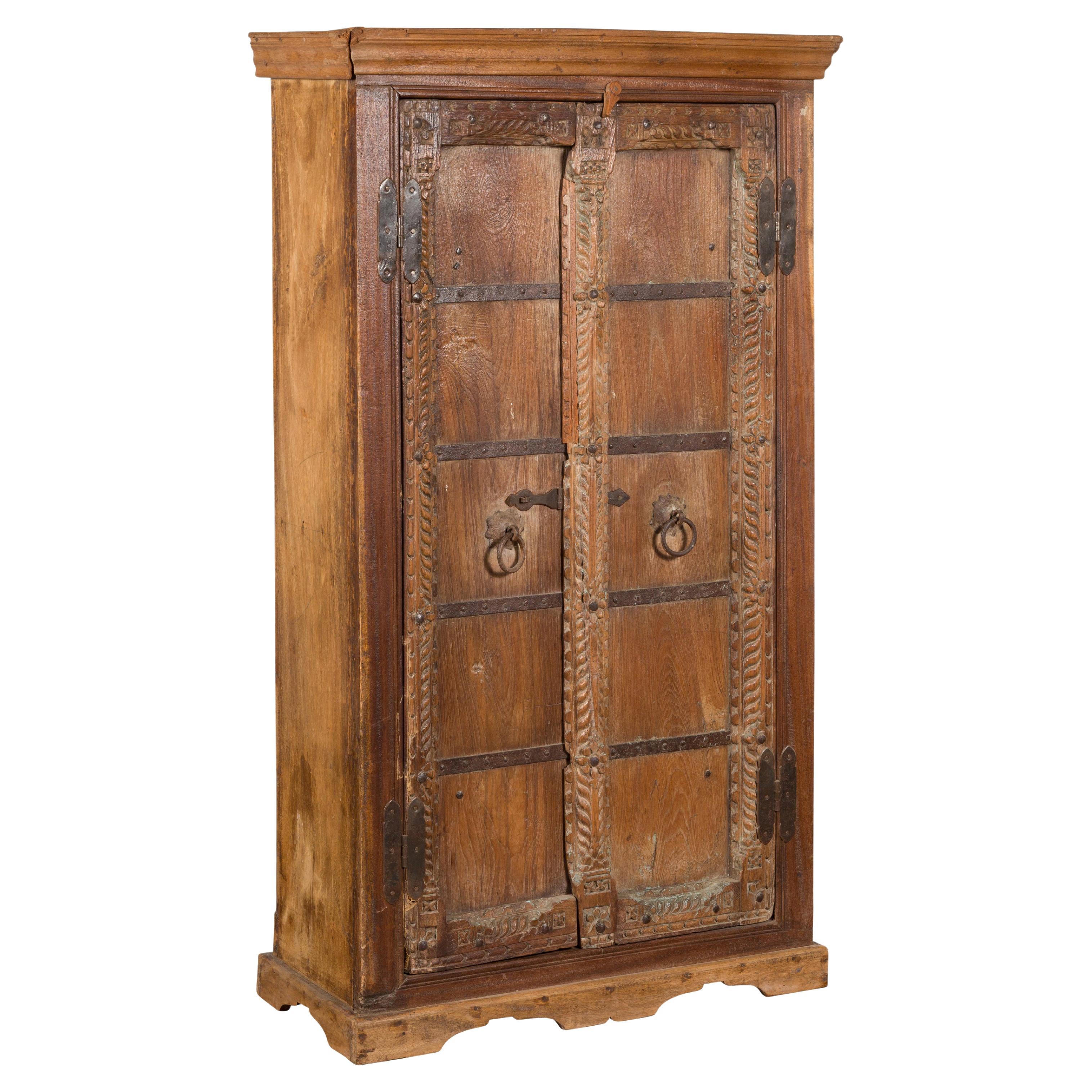 Antique 19th Century Indian Armoire with Metal Braces and Hand-Carved Décor