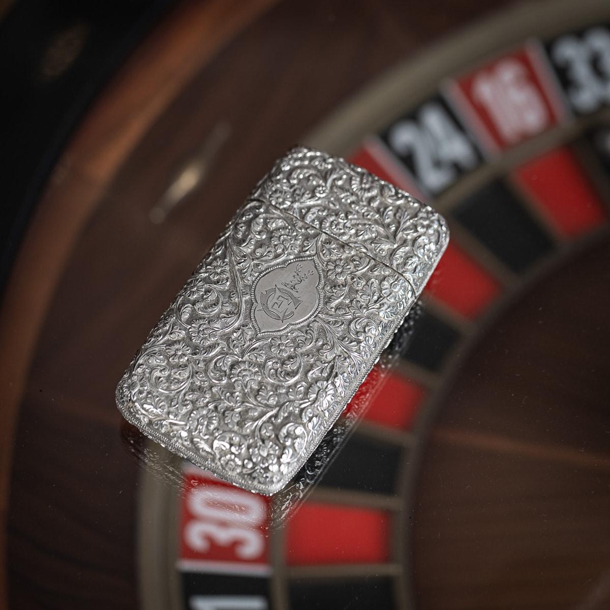Antique 19th Century Indian Kutch hand-crafted solid silver cigar case. Of rectangular form with rounded edges, finely chased throughout with scrolling leaves and floral patterns on a finely tooled matted ground. On one side engraved plaque with